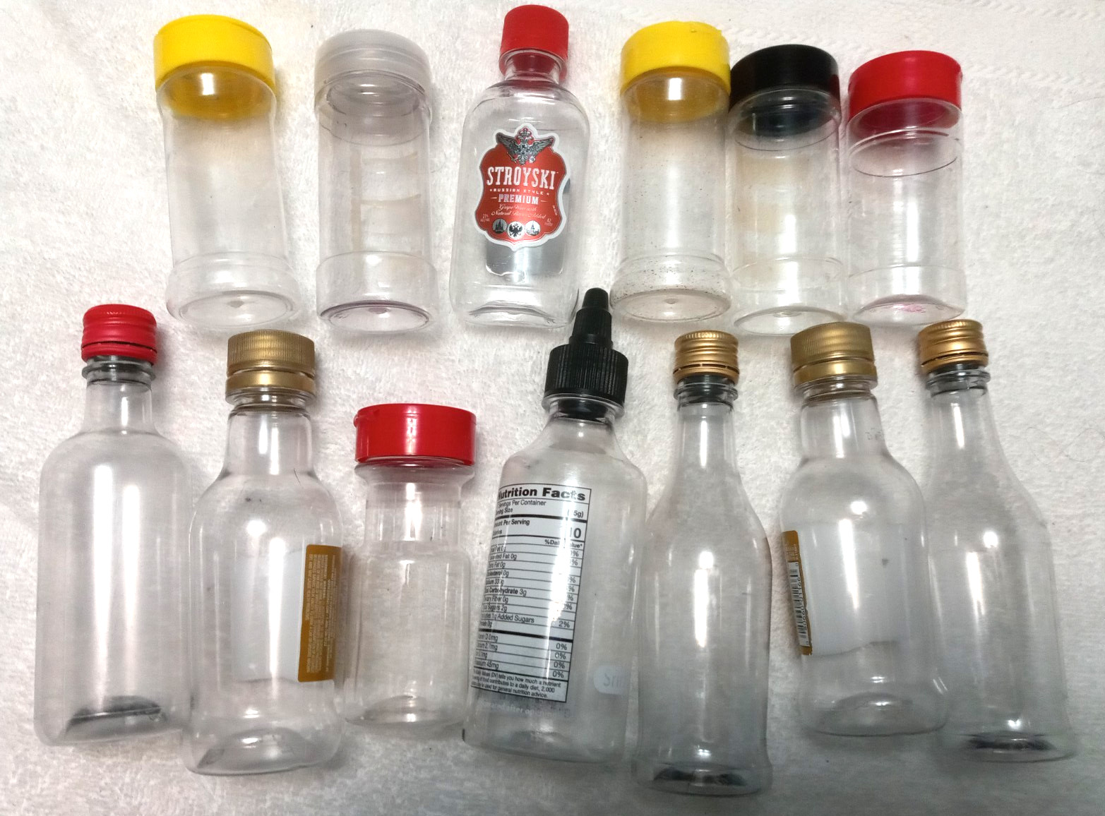 Lot of (13) Empty Plastic Small Whiskey & Spice Bottles for Crafts Storage