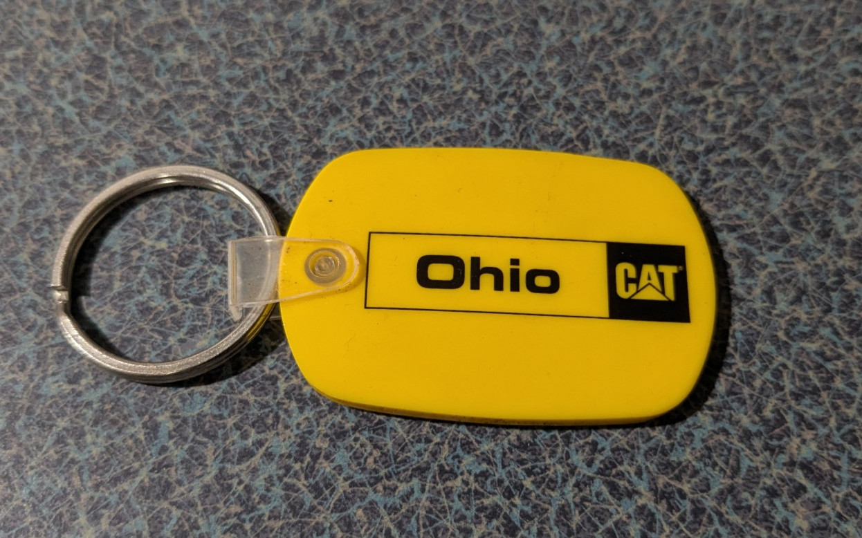 Vintage Yellow Rubber Ohio Cat Caterpillar Construction Key Chain Fob RARE