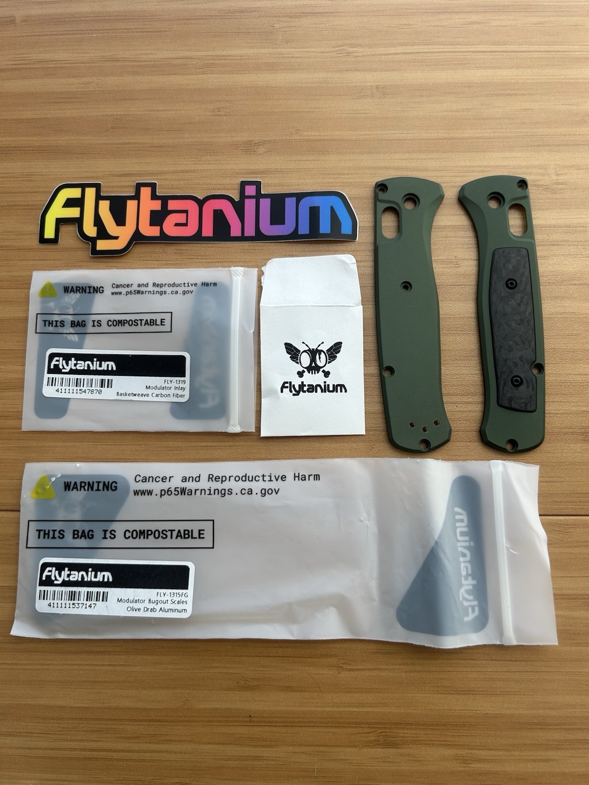 Benchmade Bugout 535 Flytanium Modulator Scales Olive Drab Alum / Carbon Fiber