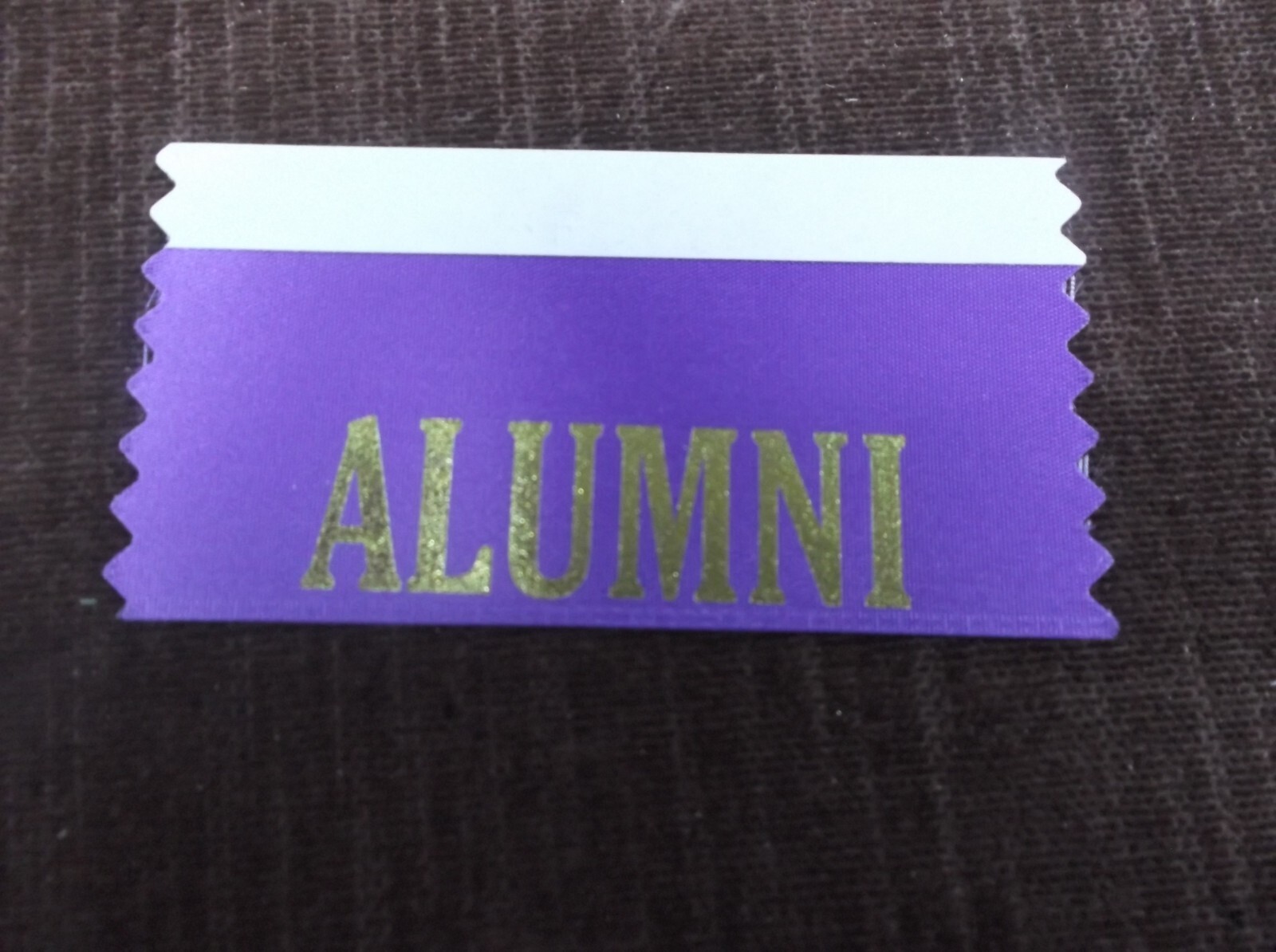 ALUMNI purple ribbon top adhesive strip with gold foil letters lot of 50