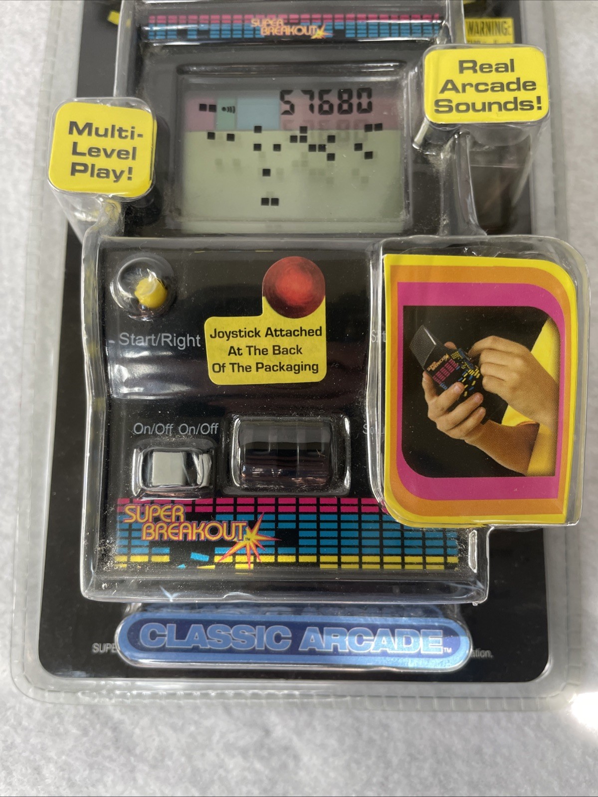 Super Breakout Electronic Handheld Game by MGA Entertainment