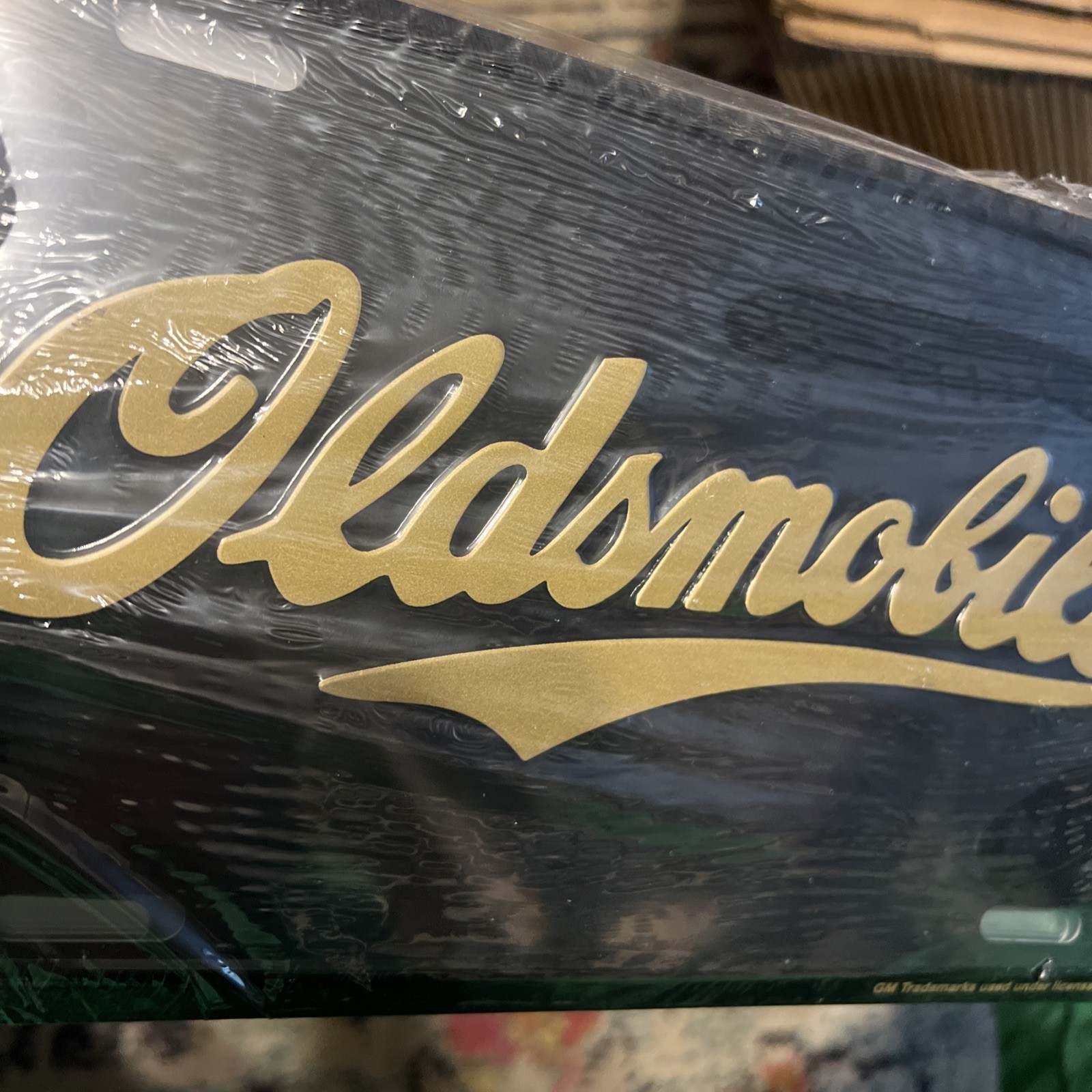 Vintage Oldsmobile Booster License Plate Sealed