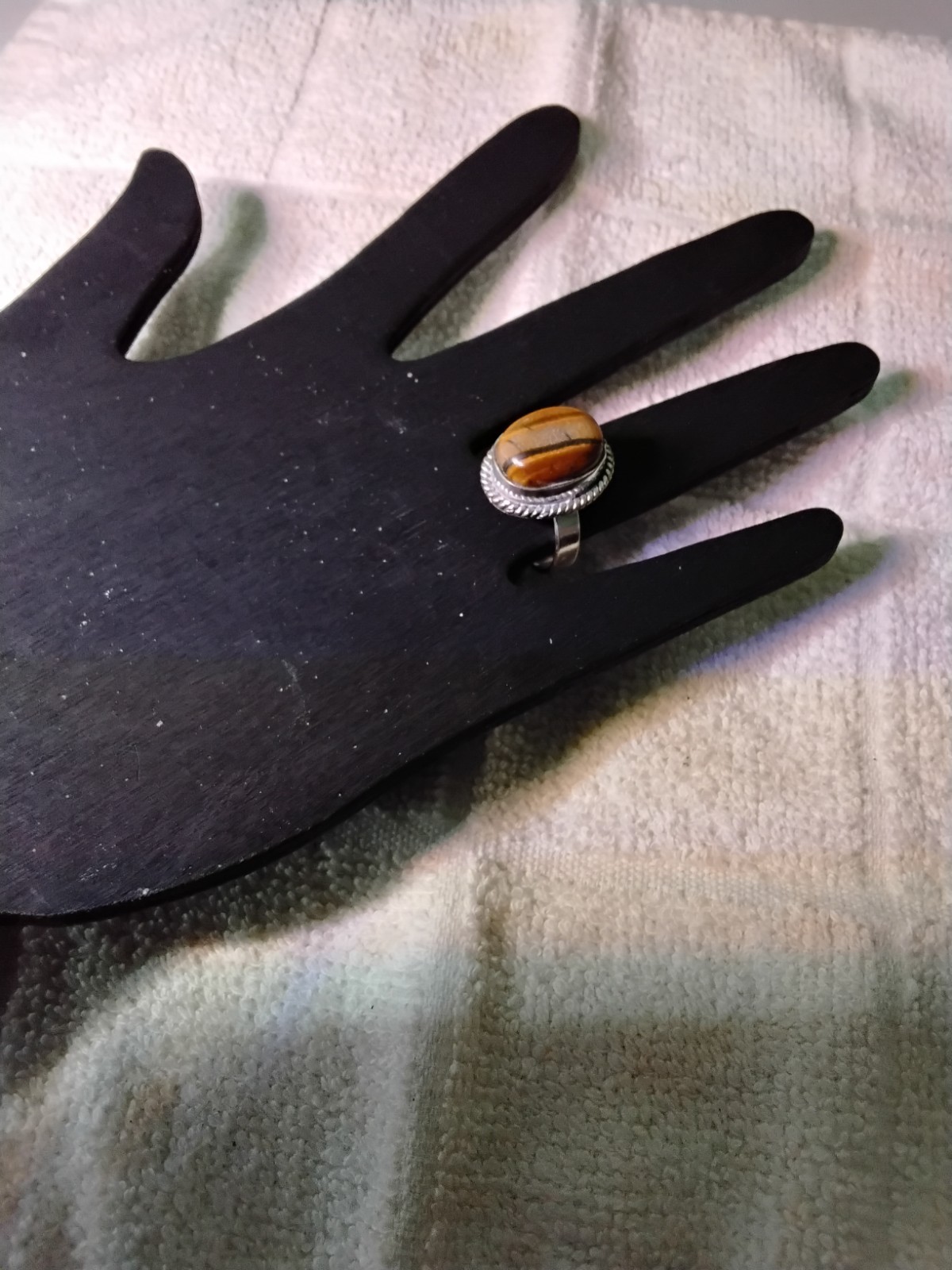 Tiger's Eye Oval Ring Bezel Set In Rhodium Plated Setting.       Size 7