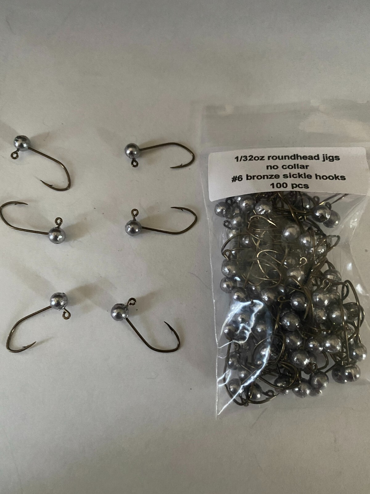 100pcs unpainted 1/32oz Roundhead jig with no collar with #6 or #4 bronze sickle