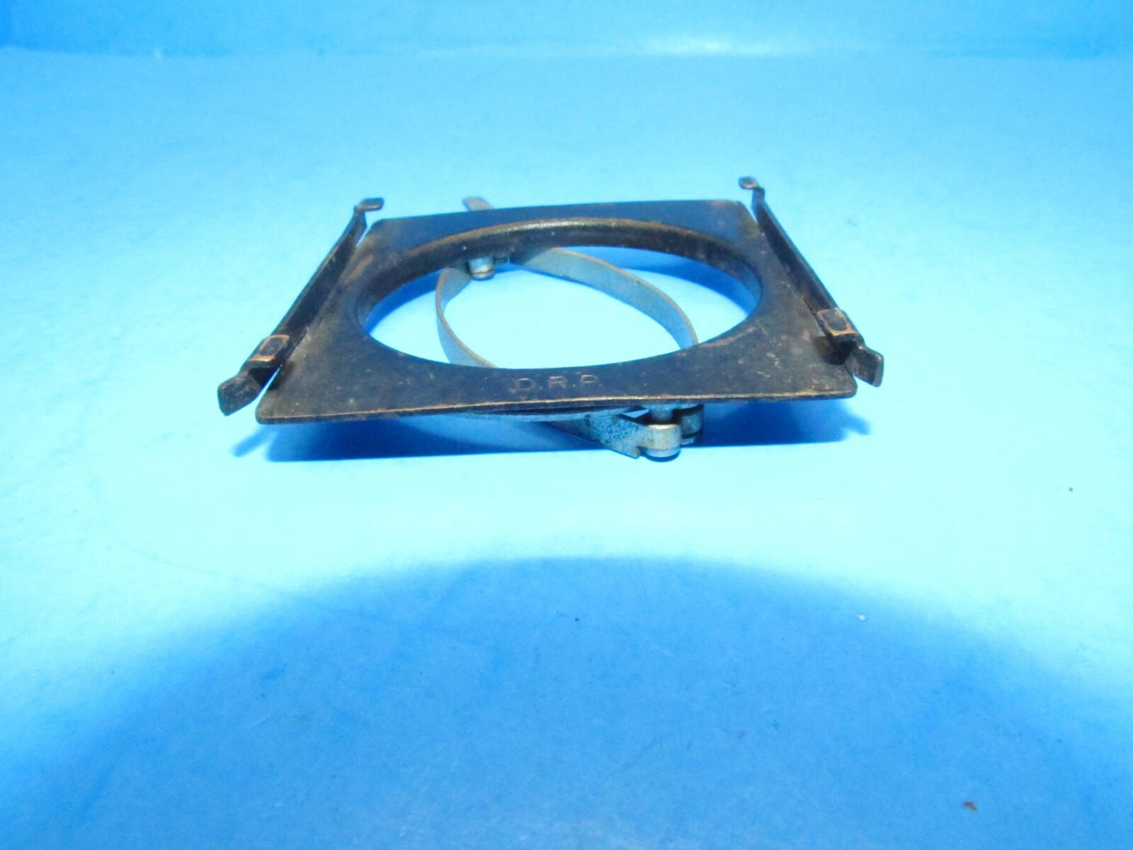 unique small filter holder marked RHACO DRP GERMANY attaches w/ spring clamps