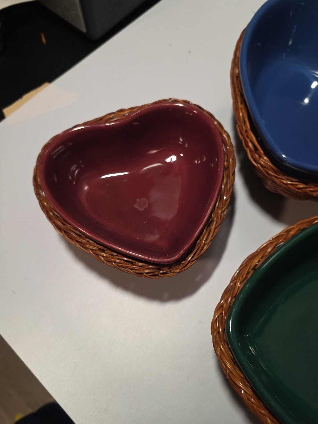 Three Heart Shaped Ceramic Stackable Bowls In Wicker Baskets Blue Green Red