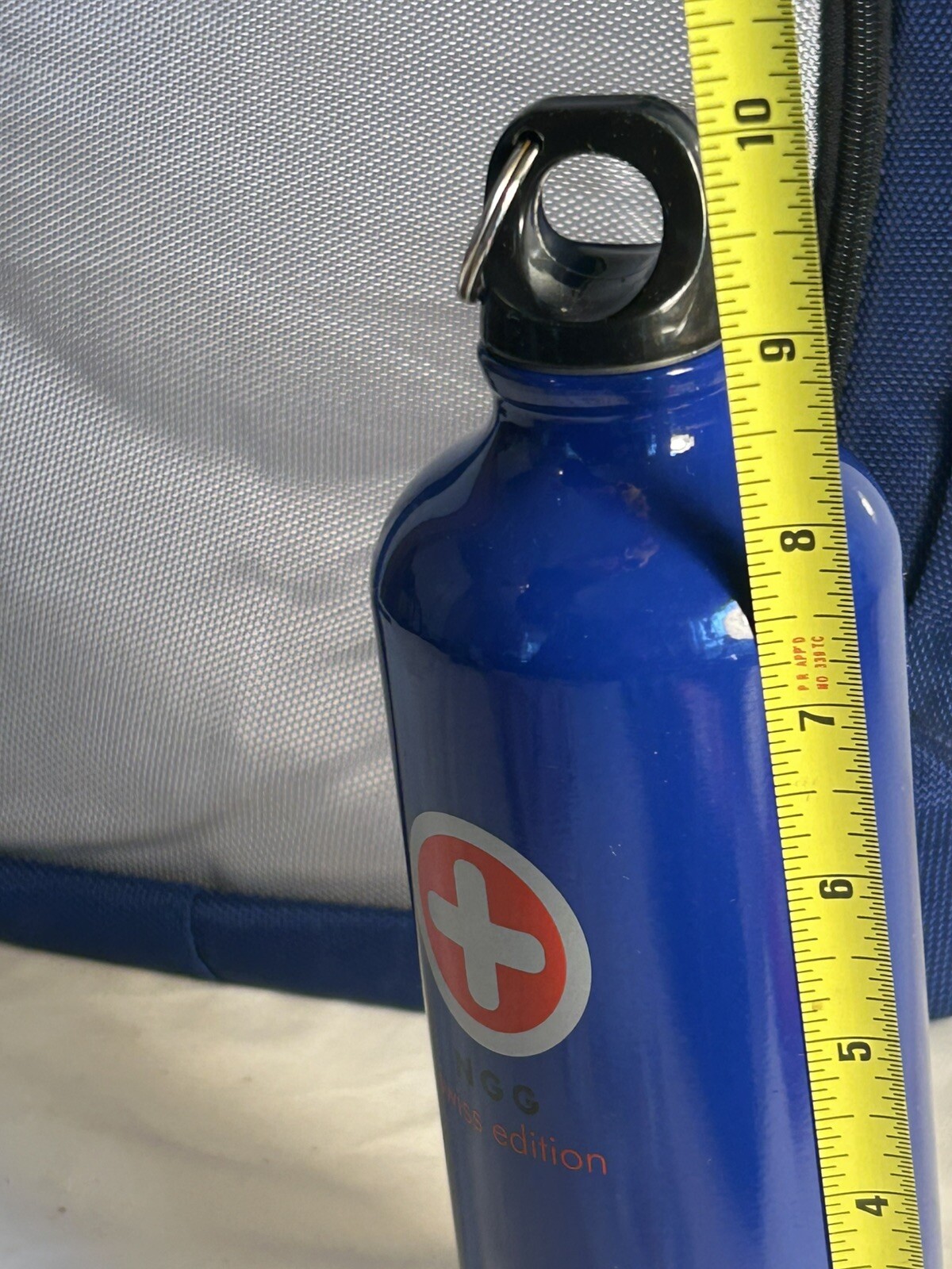 Blue/Grey NGG Swiss Edition Backpack with blue water bottle computer school