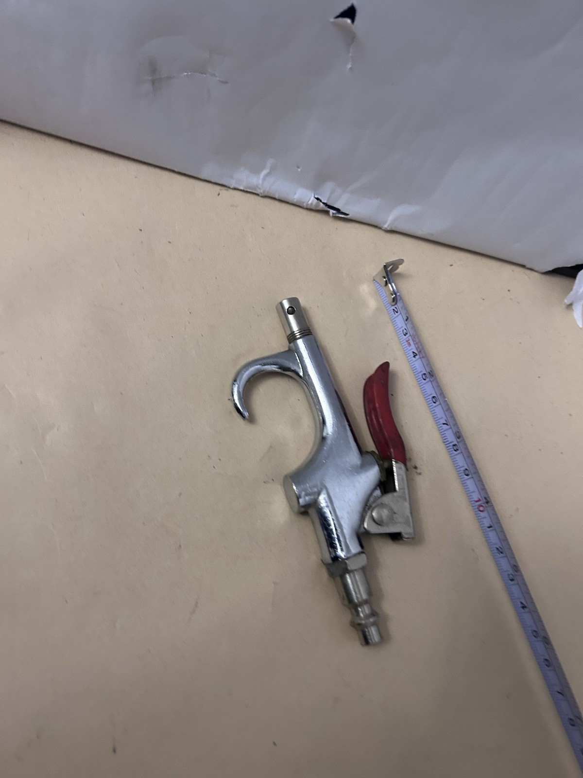 Unbranded untested pneumatic air gun with red handle