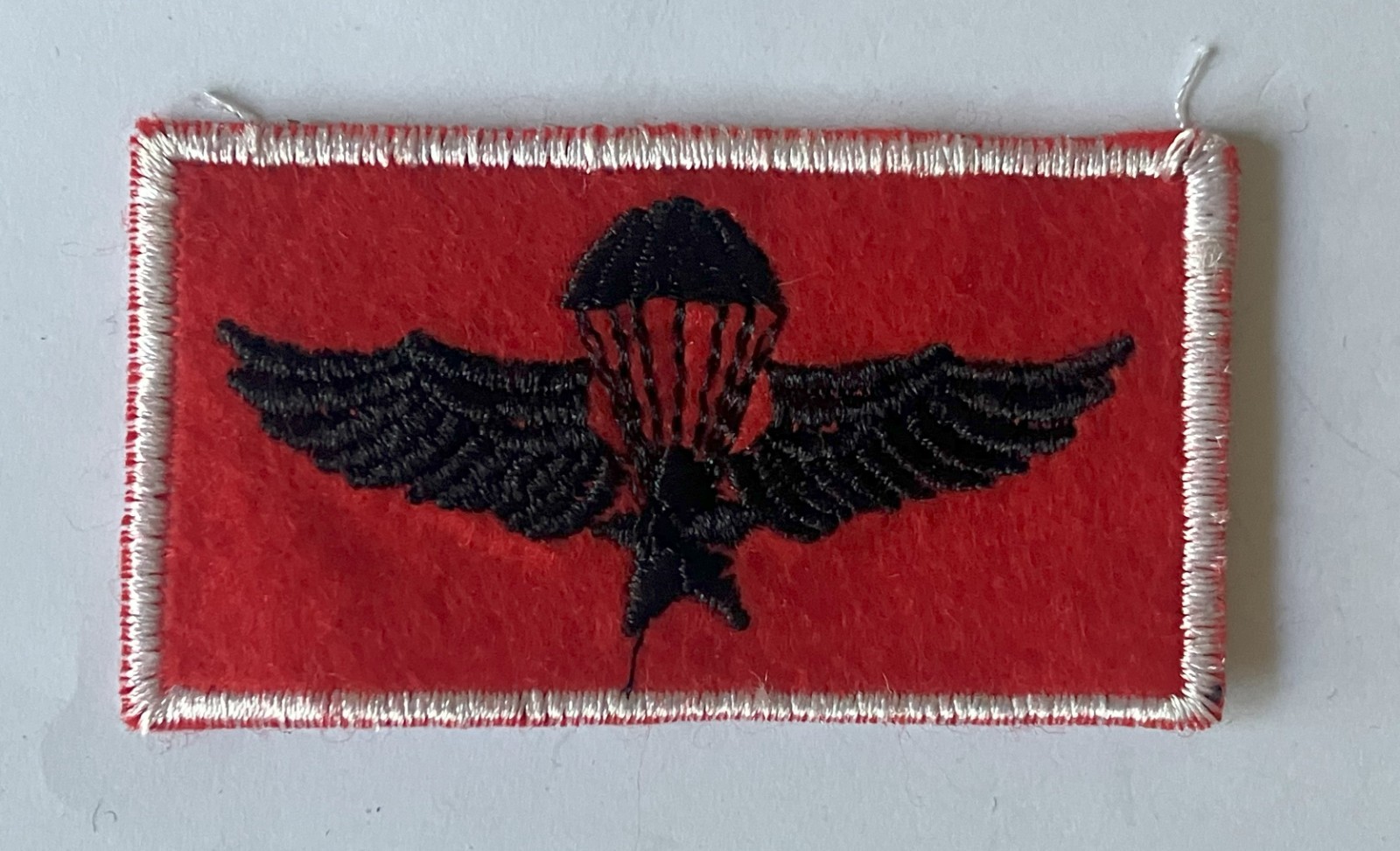 Parachute jump wings, black on red similar to Republic of Vietnam