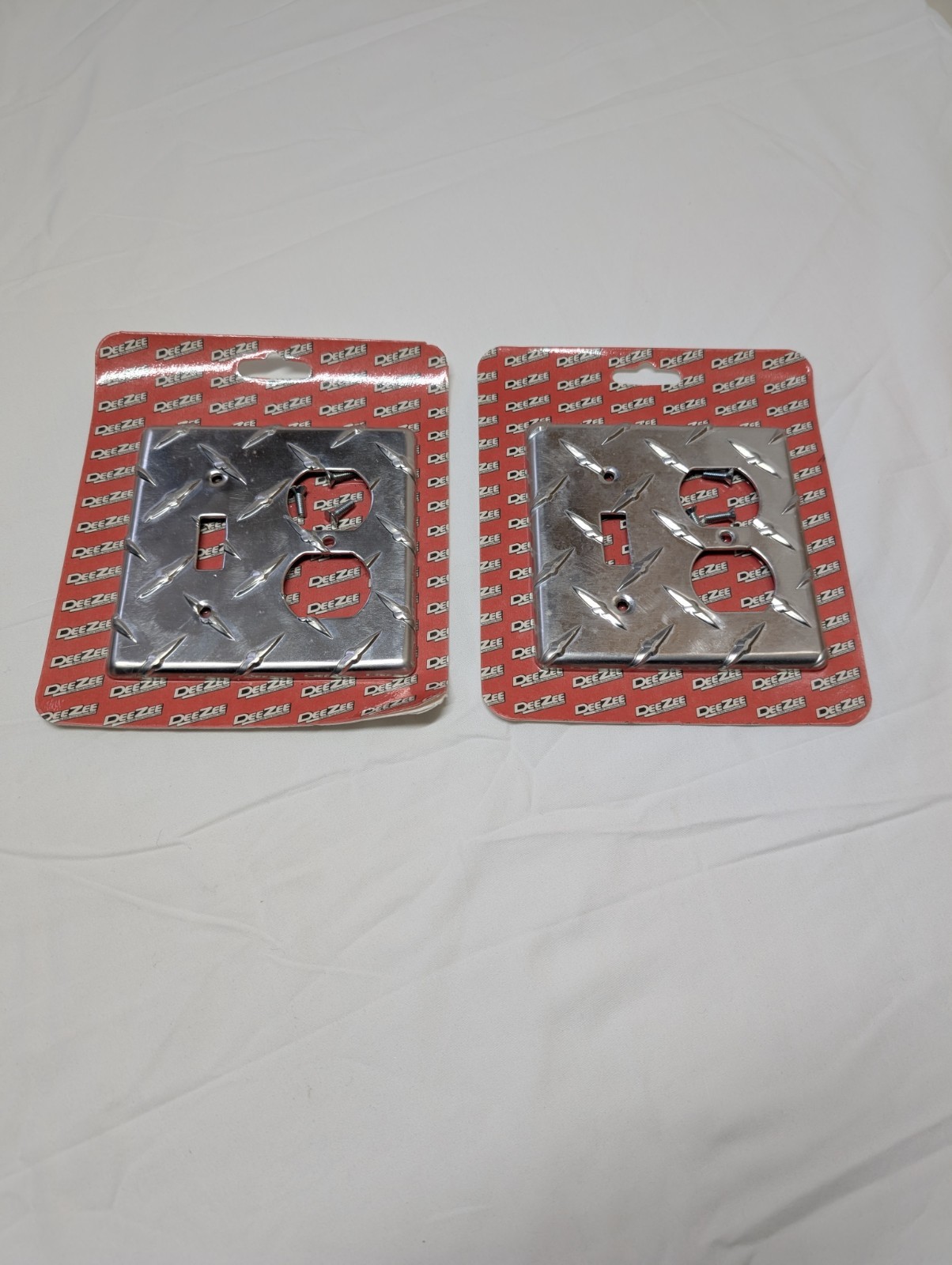 2 PCs DeeZee Brite Tread Outlet Cover. New Unopened Damaged Package