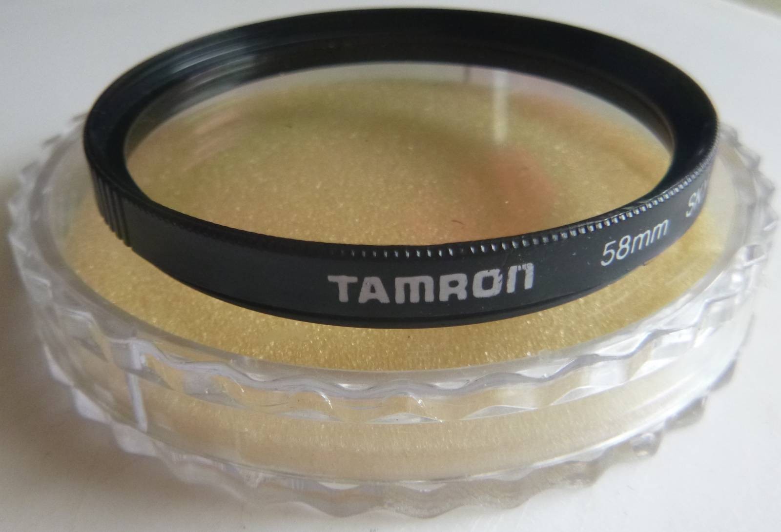 TAMRON 58mm SKY filter with plastic cover.