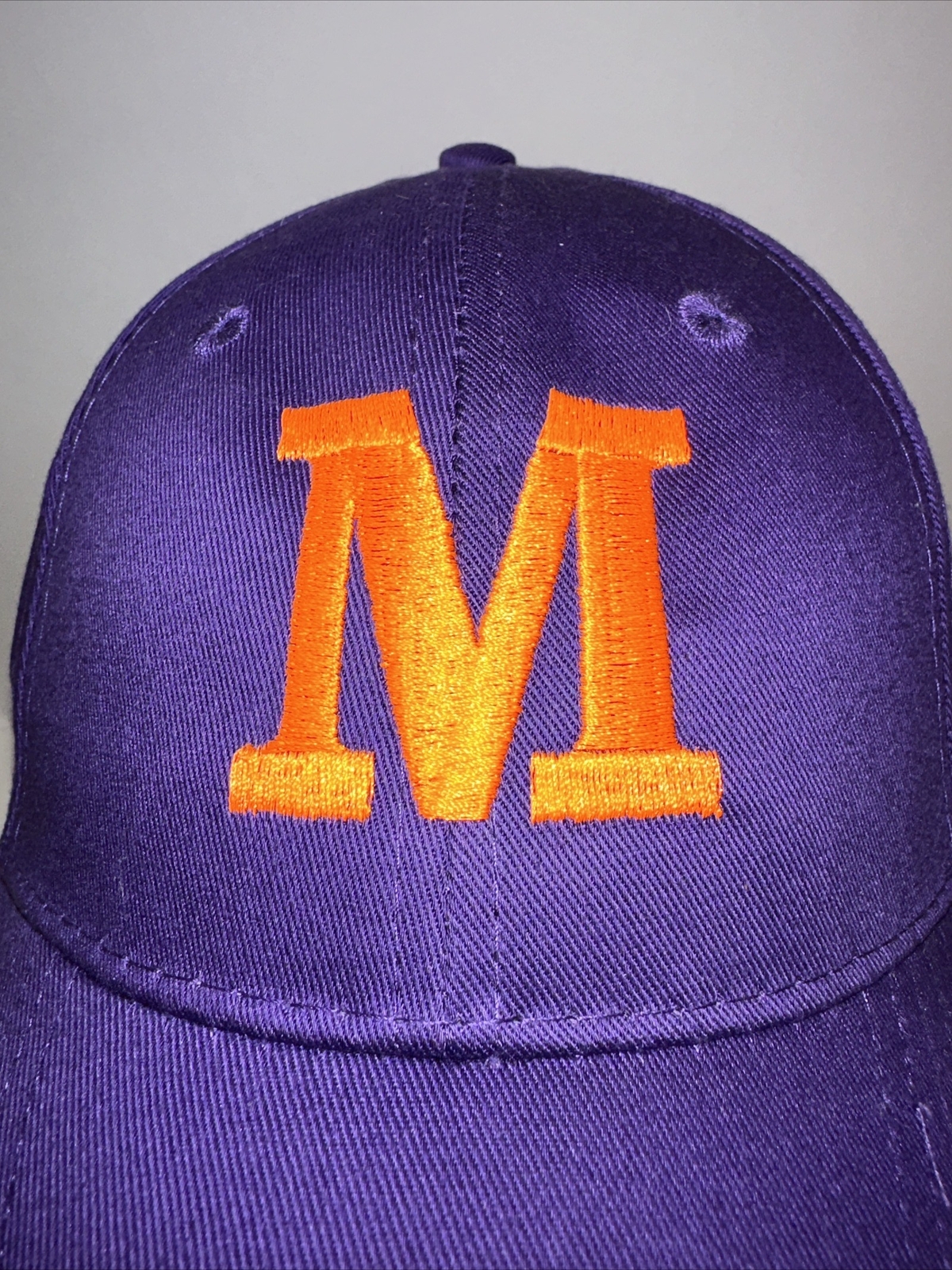 Purple Hat Cap with Orange Capitol M on the front Hook Loop