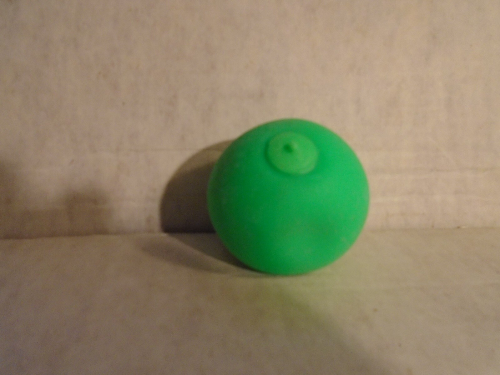 Squish Stretch Ball- Green stress relieving fun. In box, stretch/squeeze, squish