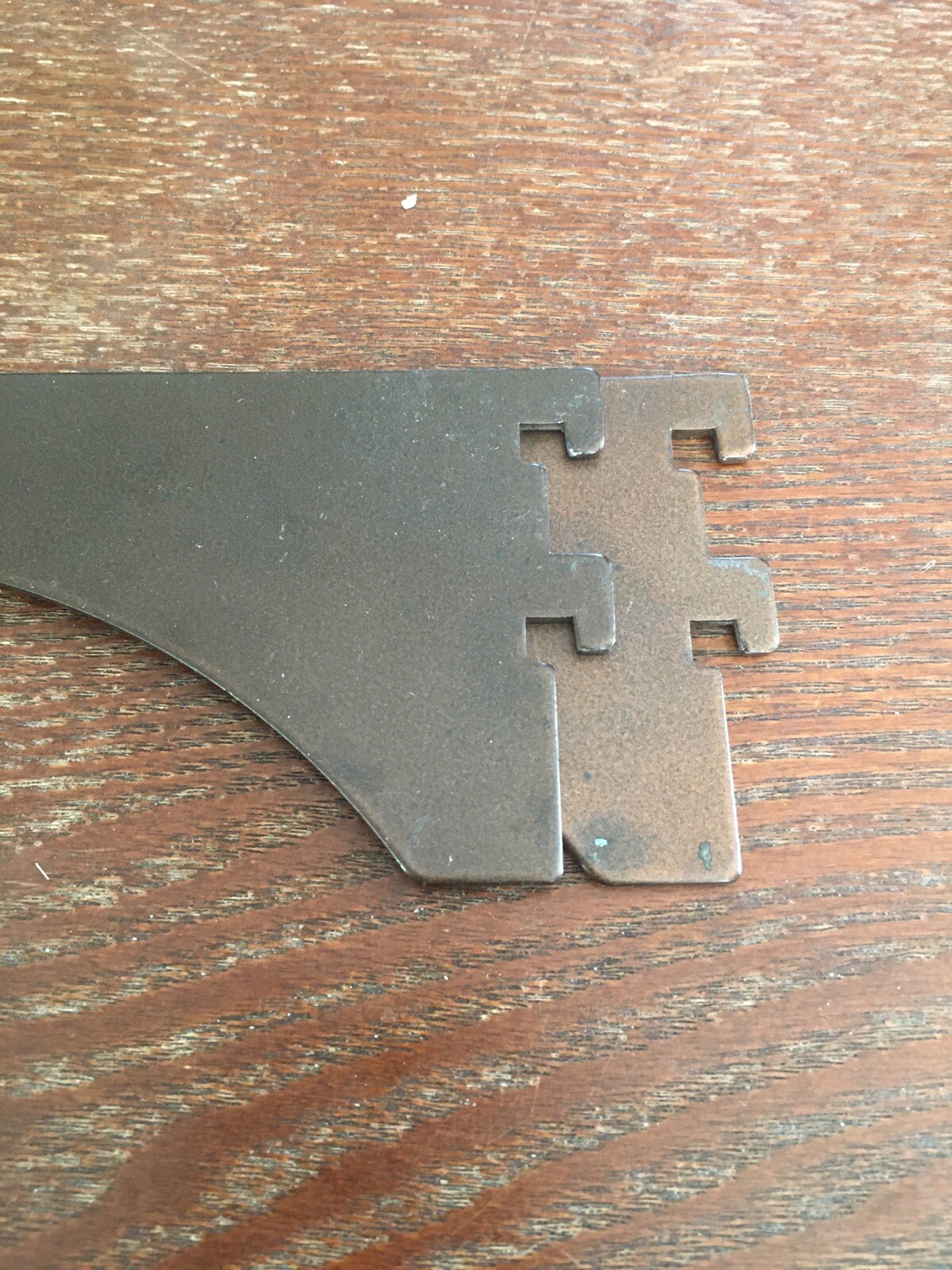 2 brown metal shelf support arms 8" after Slotted.