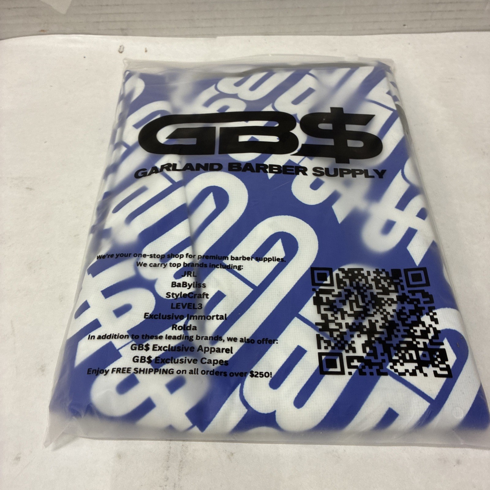 GARLAND BARBER SUPPLY CAPE  BLUE
