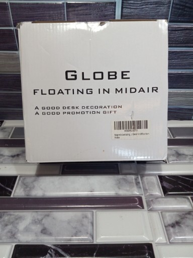 GLOBE FLOATING AND ROTATING IN MIDAIR IN C SHAPED LEVITATION | BLACK - GOLD