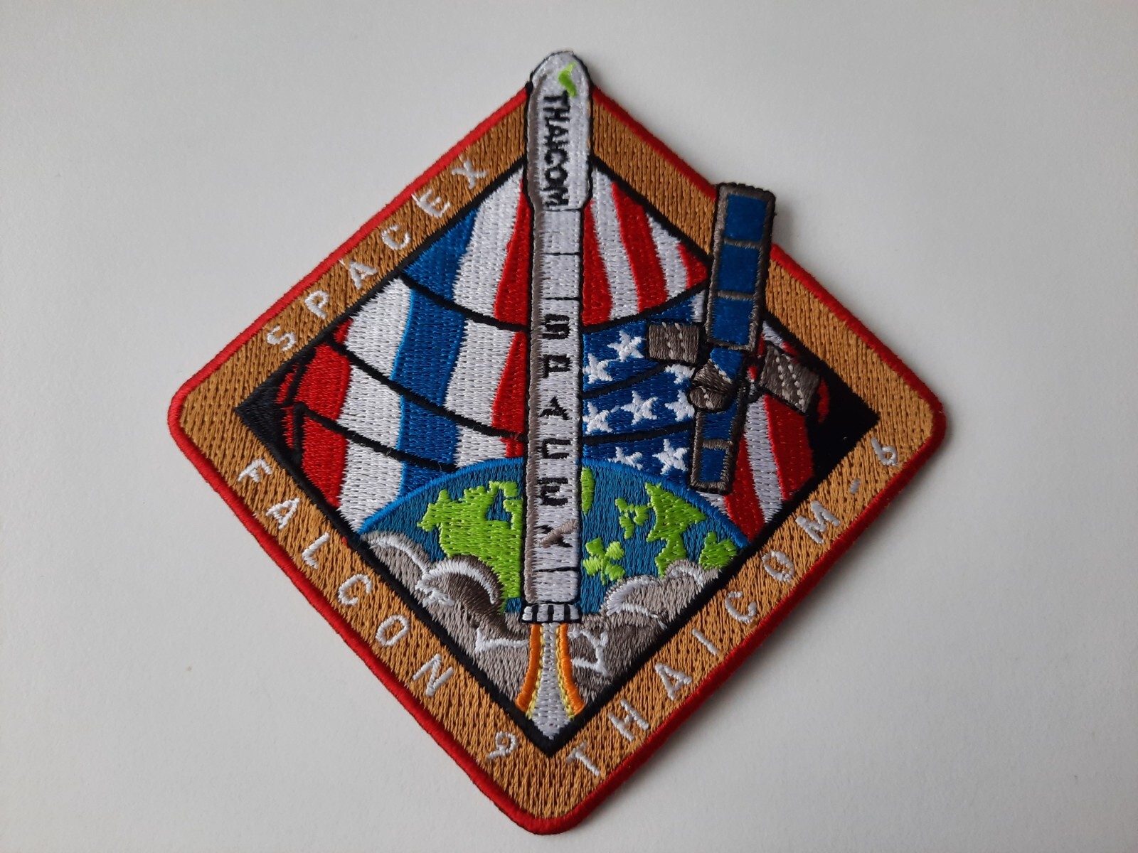 SpaceX Falcon-9 rocket launch with Thaicom-6 satellite patch