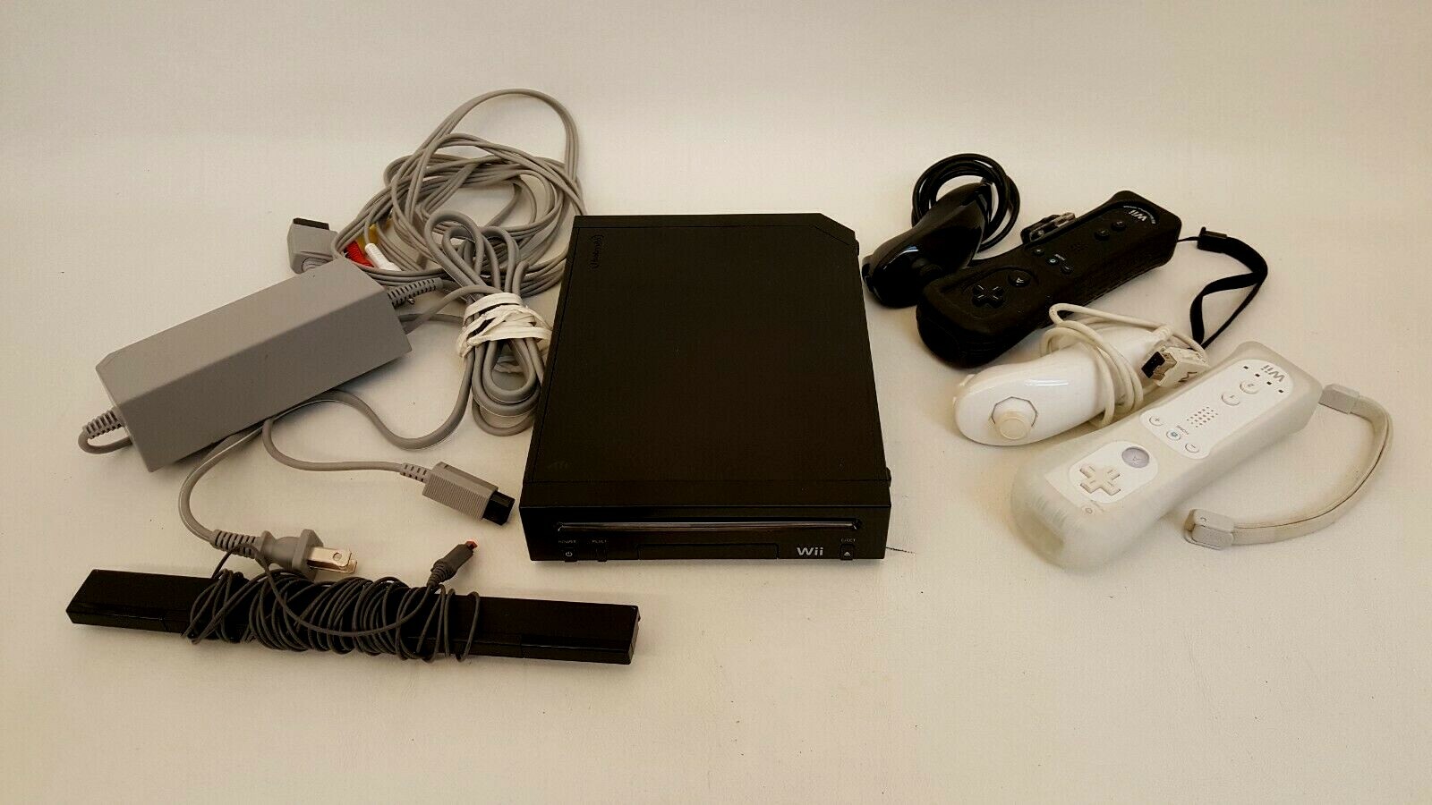Nintendo Wii black model RVL-101 + 2 controllers + nunchucks + sensor family ed