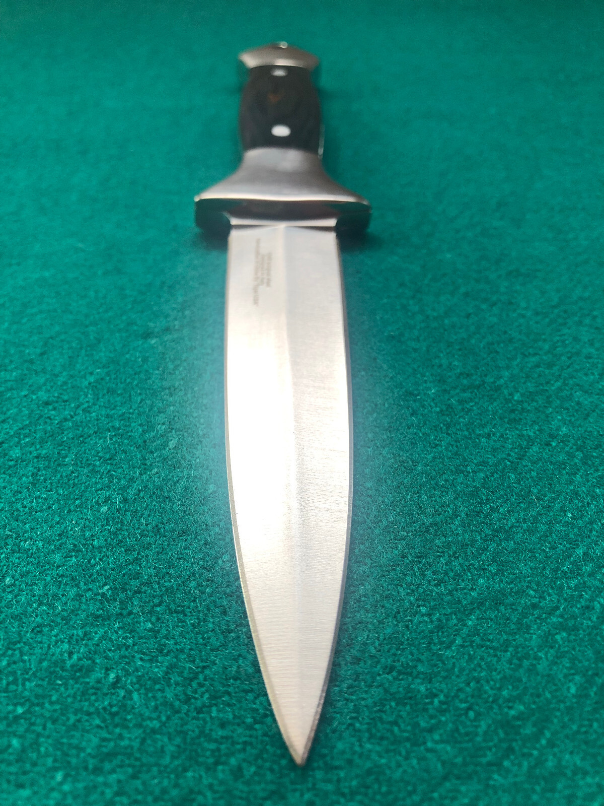 Dagger with black wooden handle