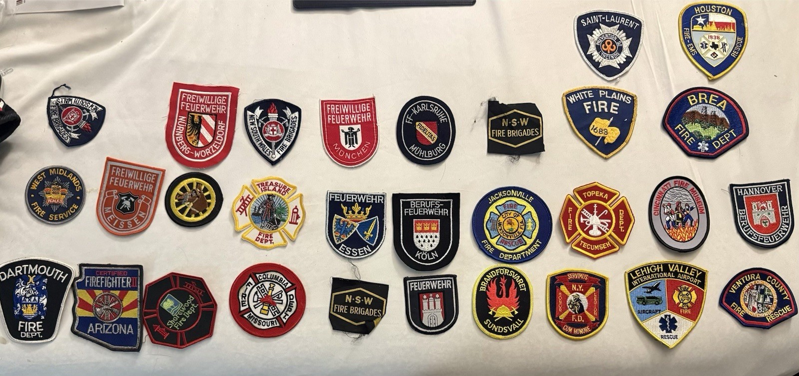 Lot of 25 Fire Dept. shoulder patches from all over the US - great lot (4)!