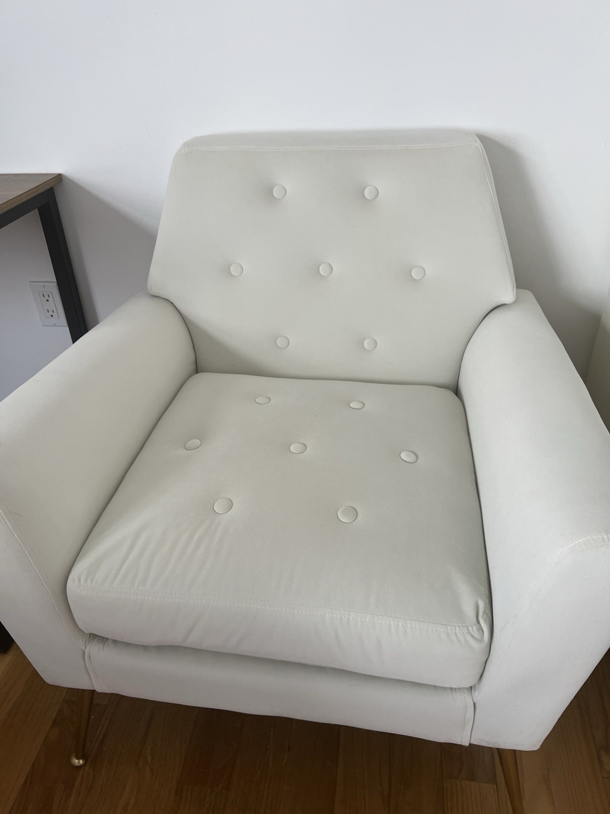 White quilted fabric armchair