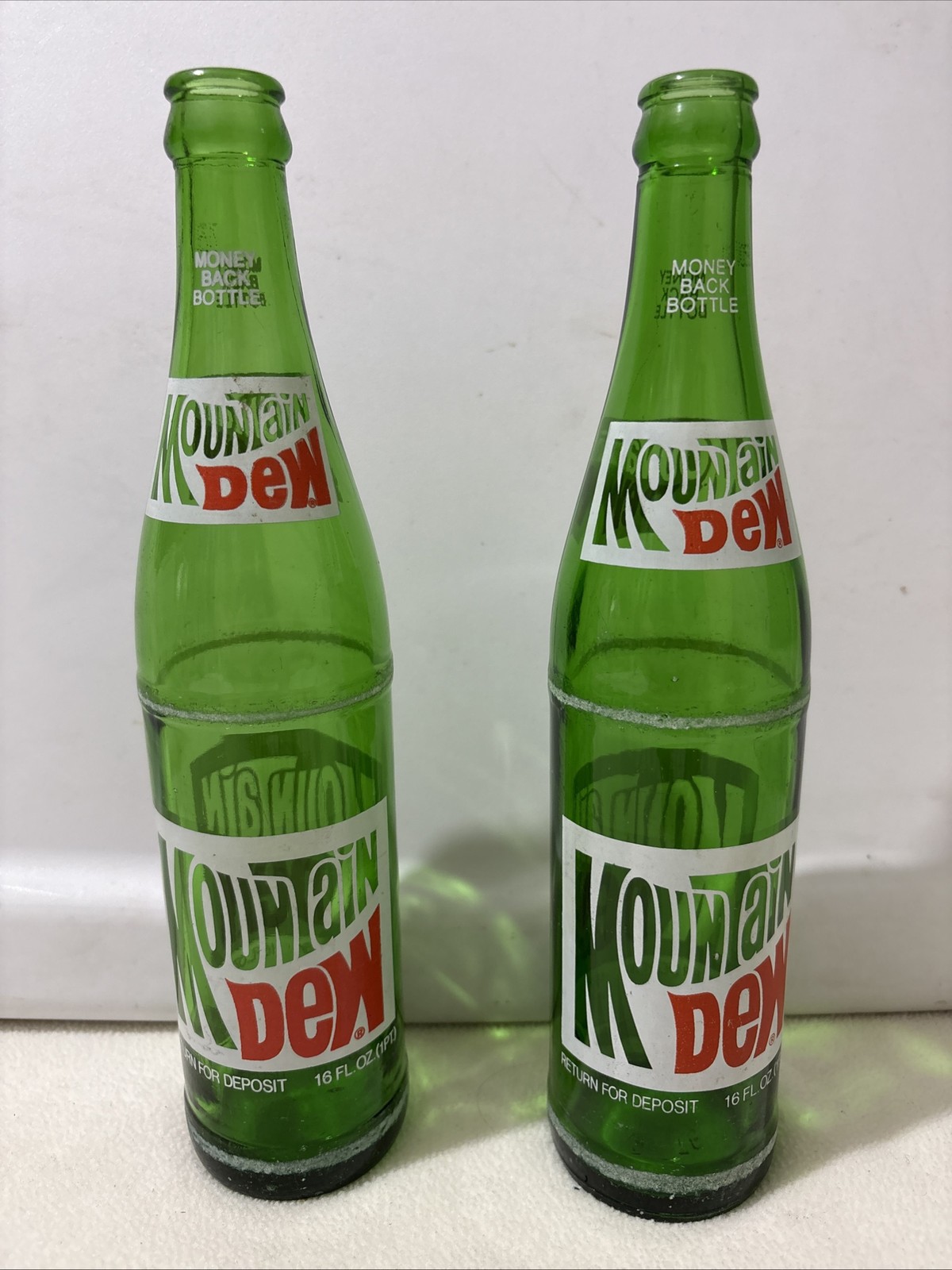 Lot of 2 Vtg 1970s 80s Mountain Dew Bottles 16 oz. Green Glass Money Back Bottle