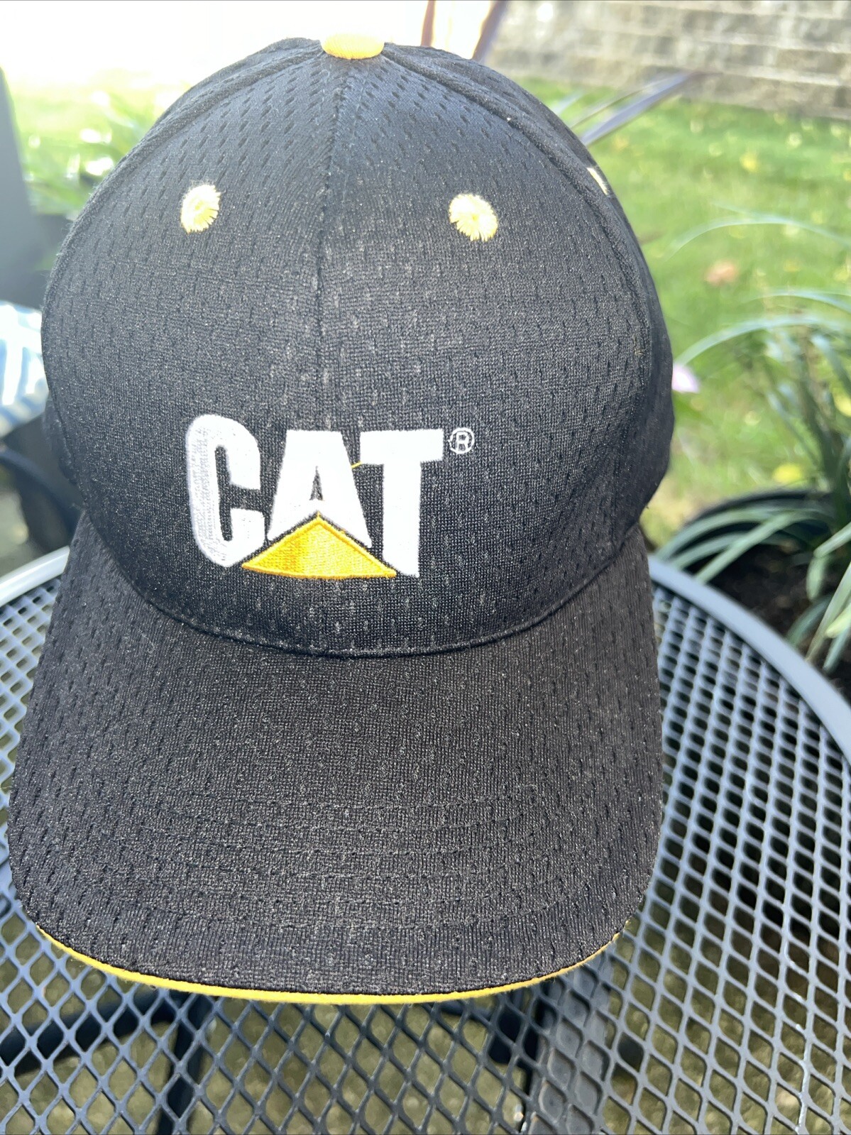 CAT in White w Gold Logo on Black Hat Cap Polyester Mesh Hook Loop CAT Licensed