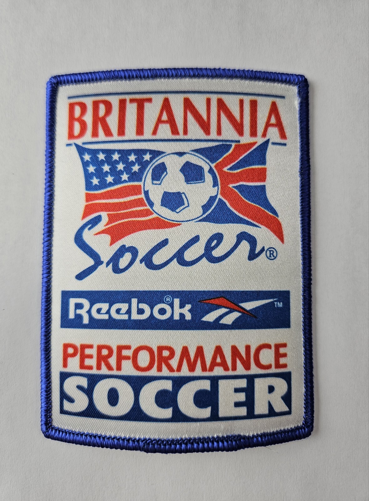 Britannia Soccer Reebok Performance Sport Patch Team Late 90s Program Memorabila