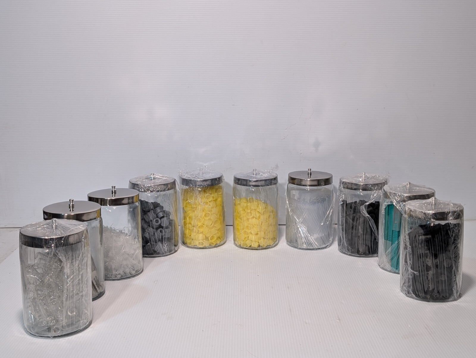 Lot of 10 medical containers with metal covers, assorted medical tools as shown