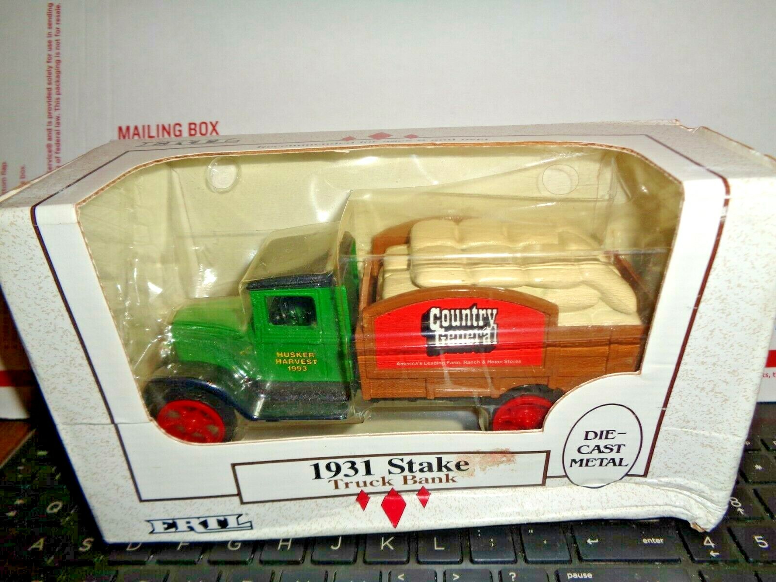 1931 ERTL DIECAST STAKE COUNTRY GENERAL HUSKER HARVEST TRUCK BANK NEW IN BOX