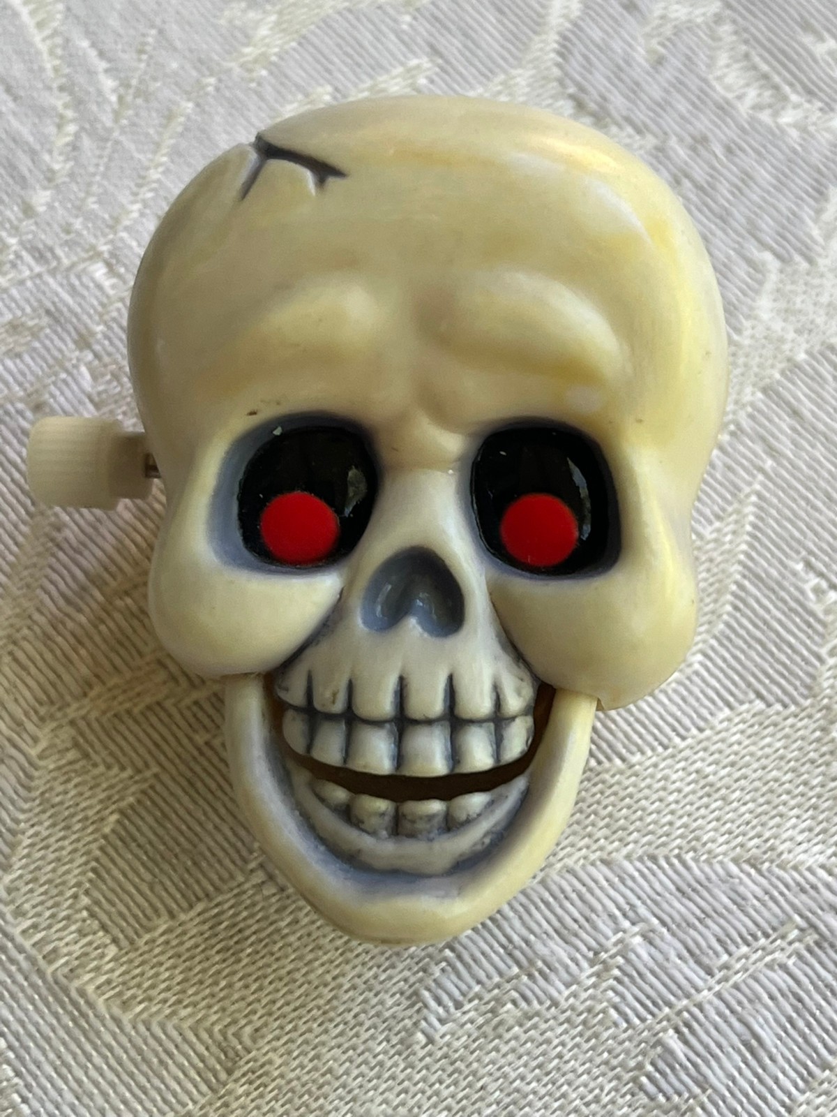 Vintage 1985 Hallmark Brooch Lapel Pin Halloween Wind-Up Skeleton Skull Red Eyes