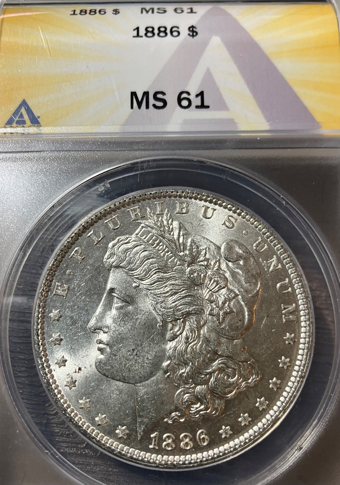 1886 $ MORGAN, ANACS MS-61, WELL STRUCK, NICE LUSTER, A FEW SCUFF MARKS,