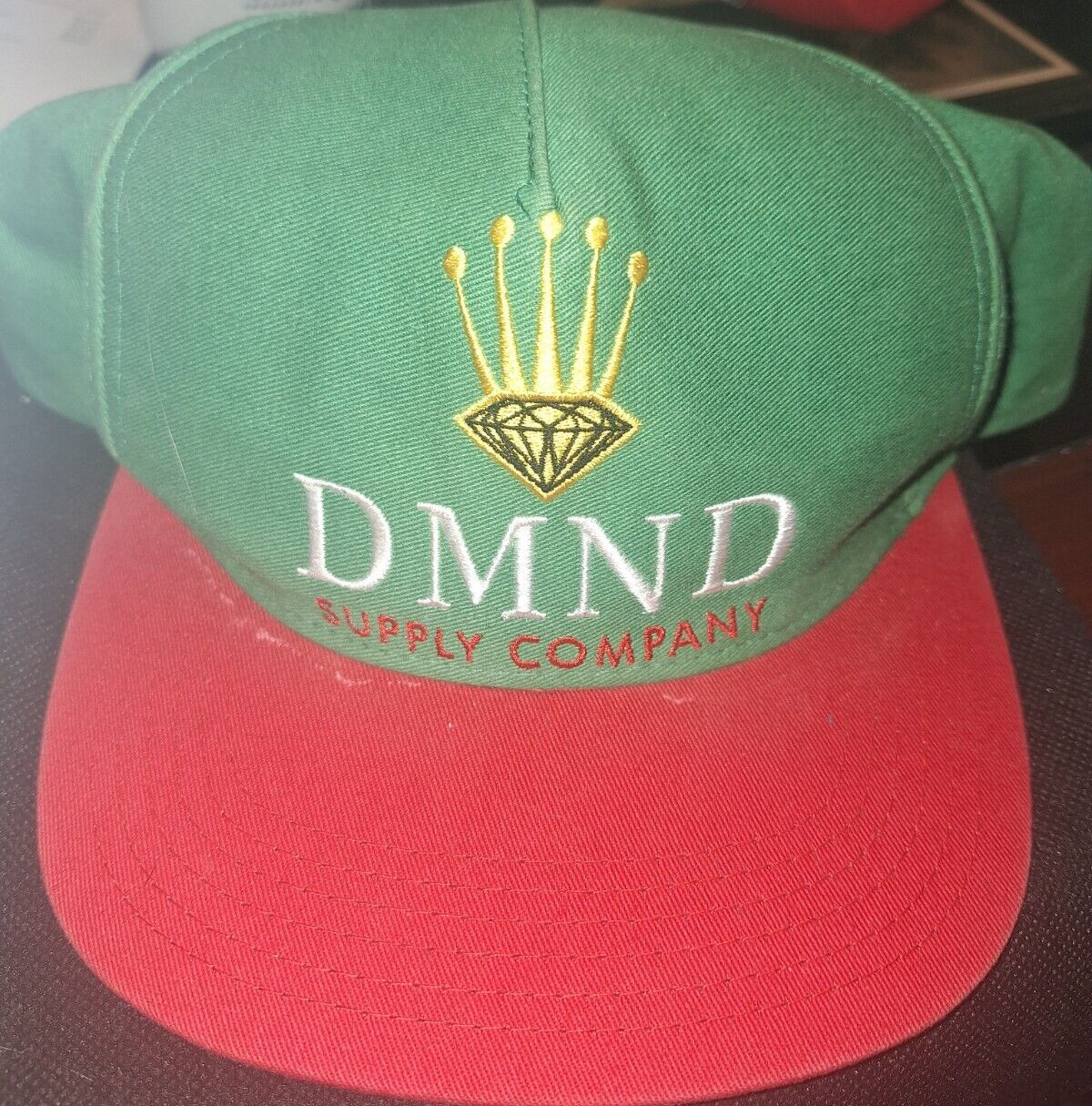 DMND SUPPLY COMPANY ADJUSTABLE RED AND GREEN CAP!  e9537DXX