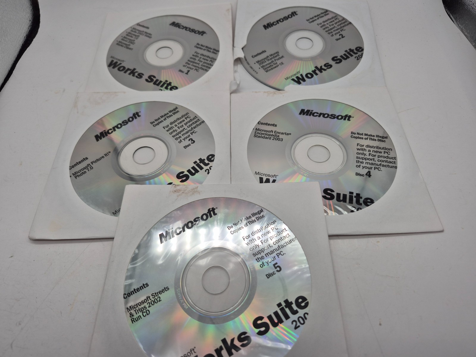 Microsoft works suite 2003-5 discs-pre owned
