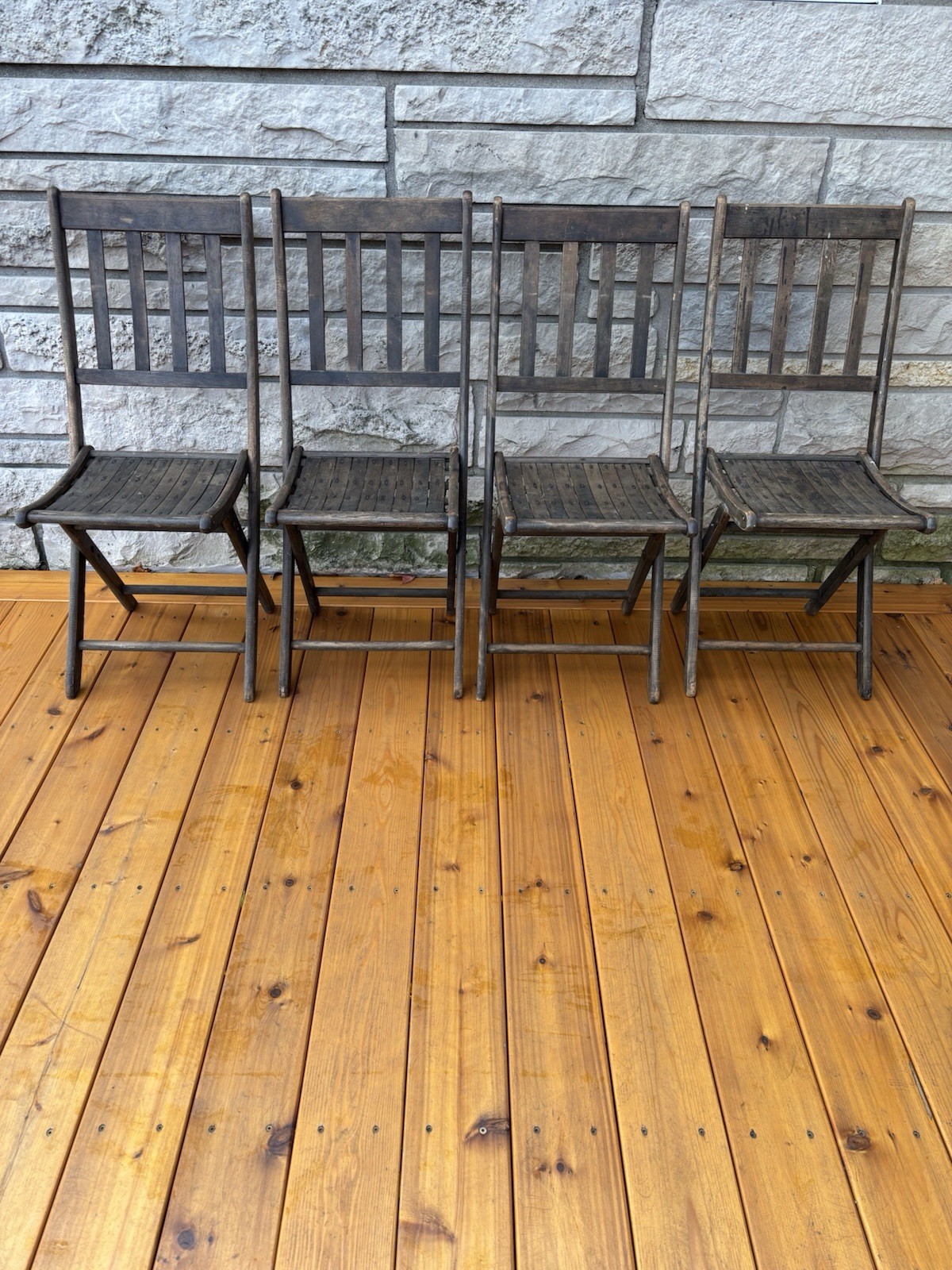 4 matching wooden folding slat chairs manufactured by Dillingham Mfg. Co. WI