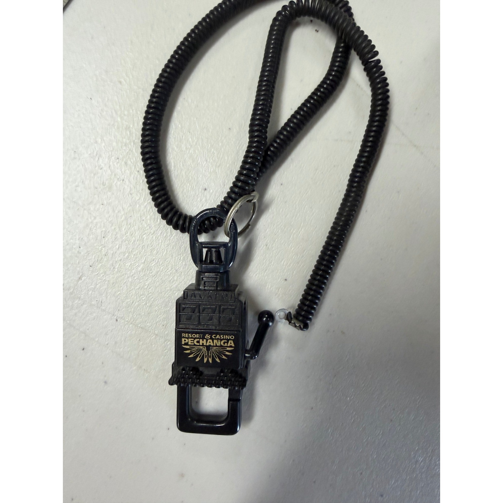 Pechanga Resort Casino Slot Machine Keychain with Coiled Lanyard Black Gold 777