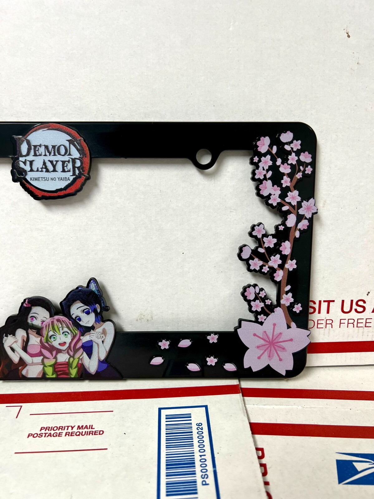 Demon Slayer License Plate Frame featuring Nezuko, Shinobu, and Matsuri