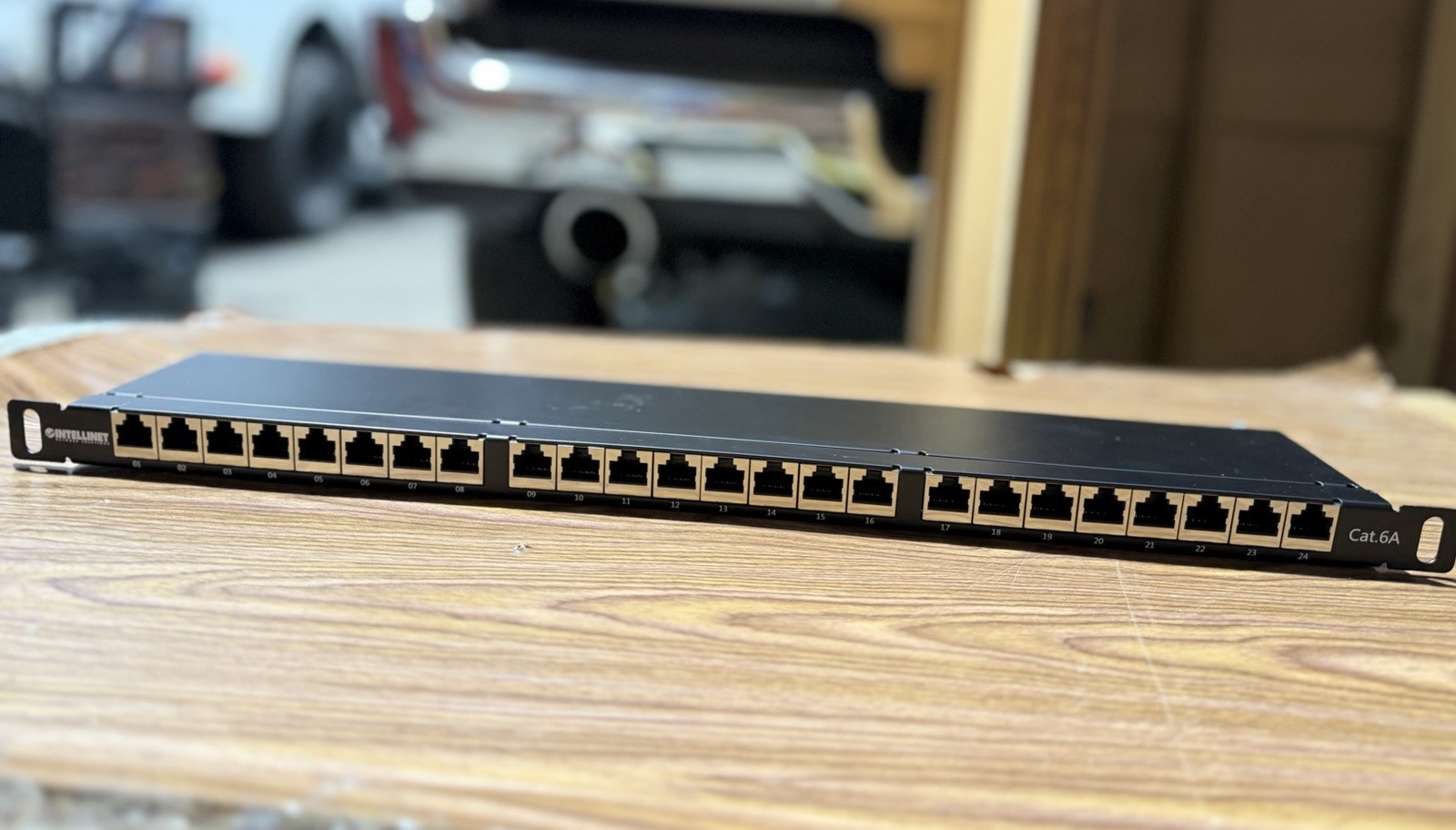 Intellinet 24-Port Cat6A Shielded Patch Panel, 19", Top-Entry, Black