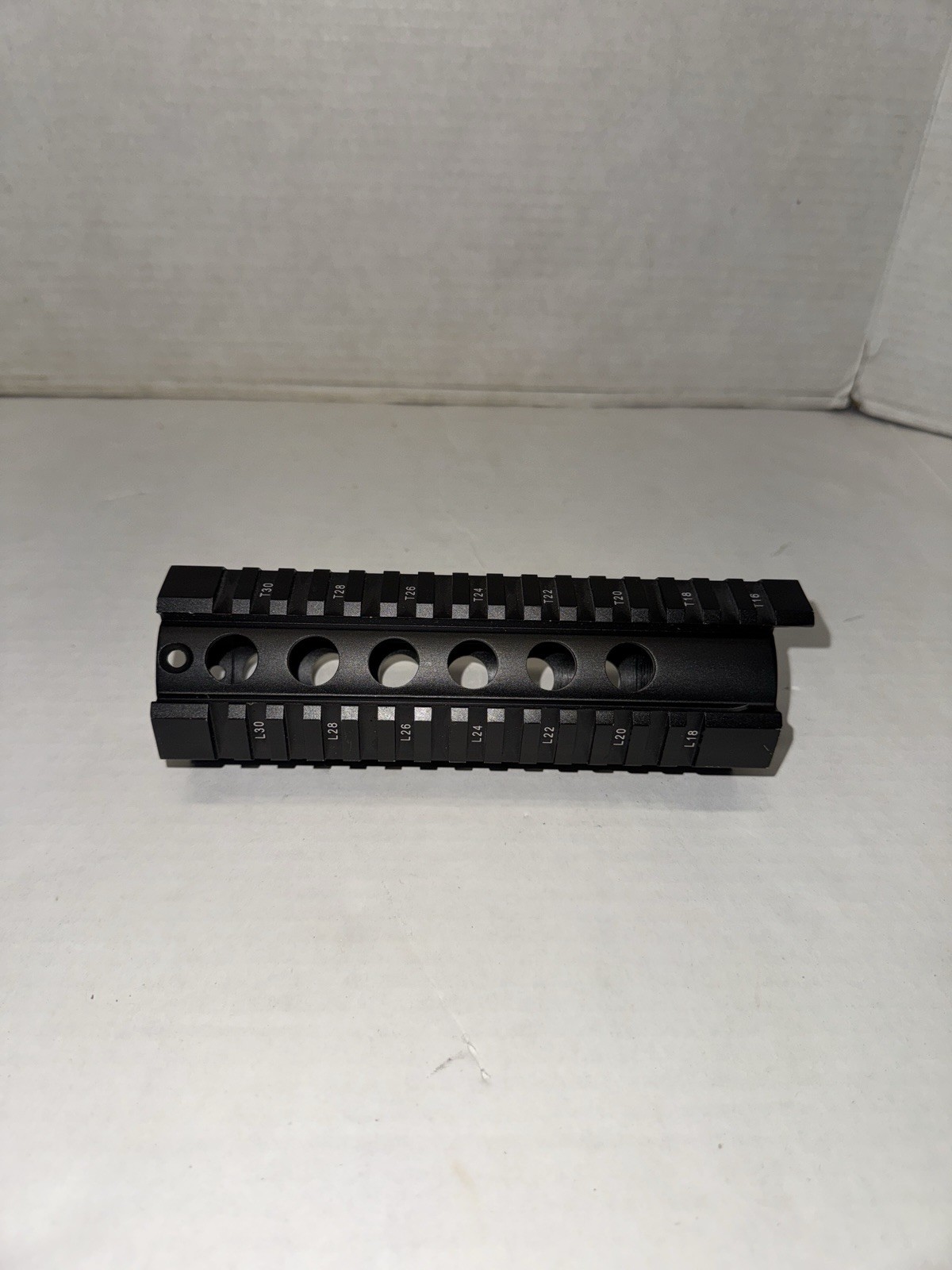 Airsoft quad rail 7.25 inch picatinny with mounting hardware.