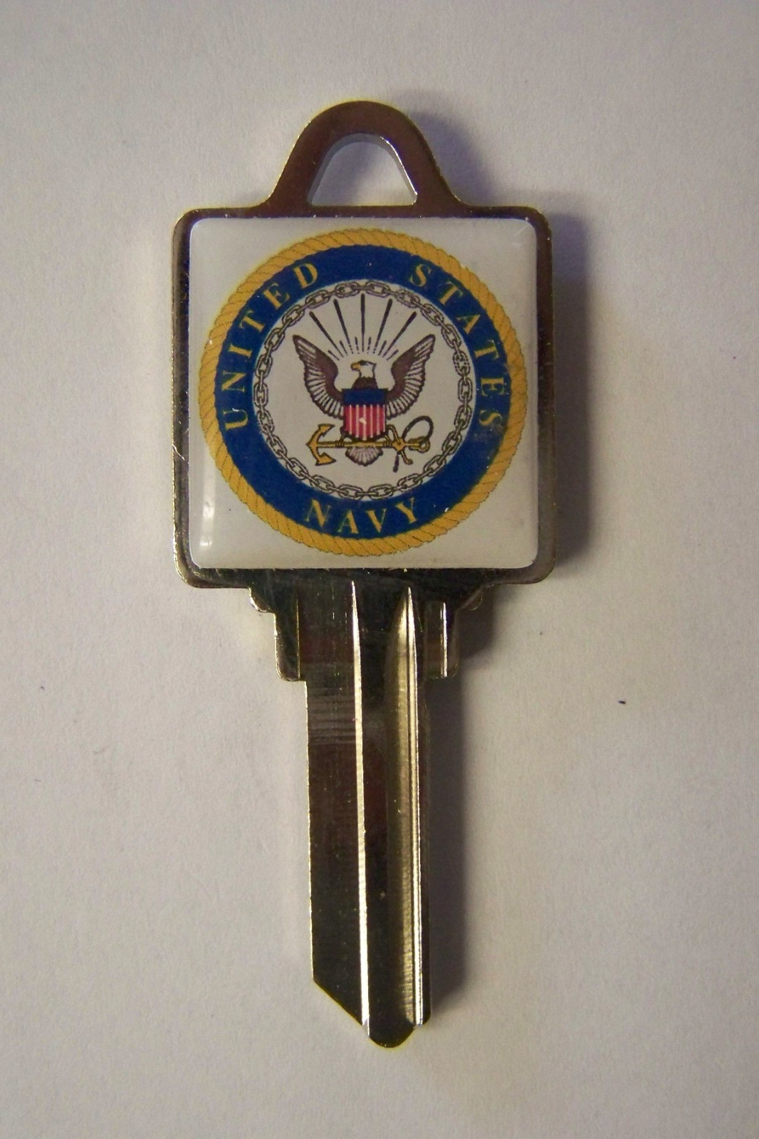 Navy Schlage SC1 house key blank.