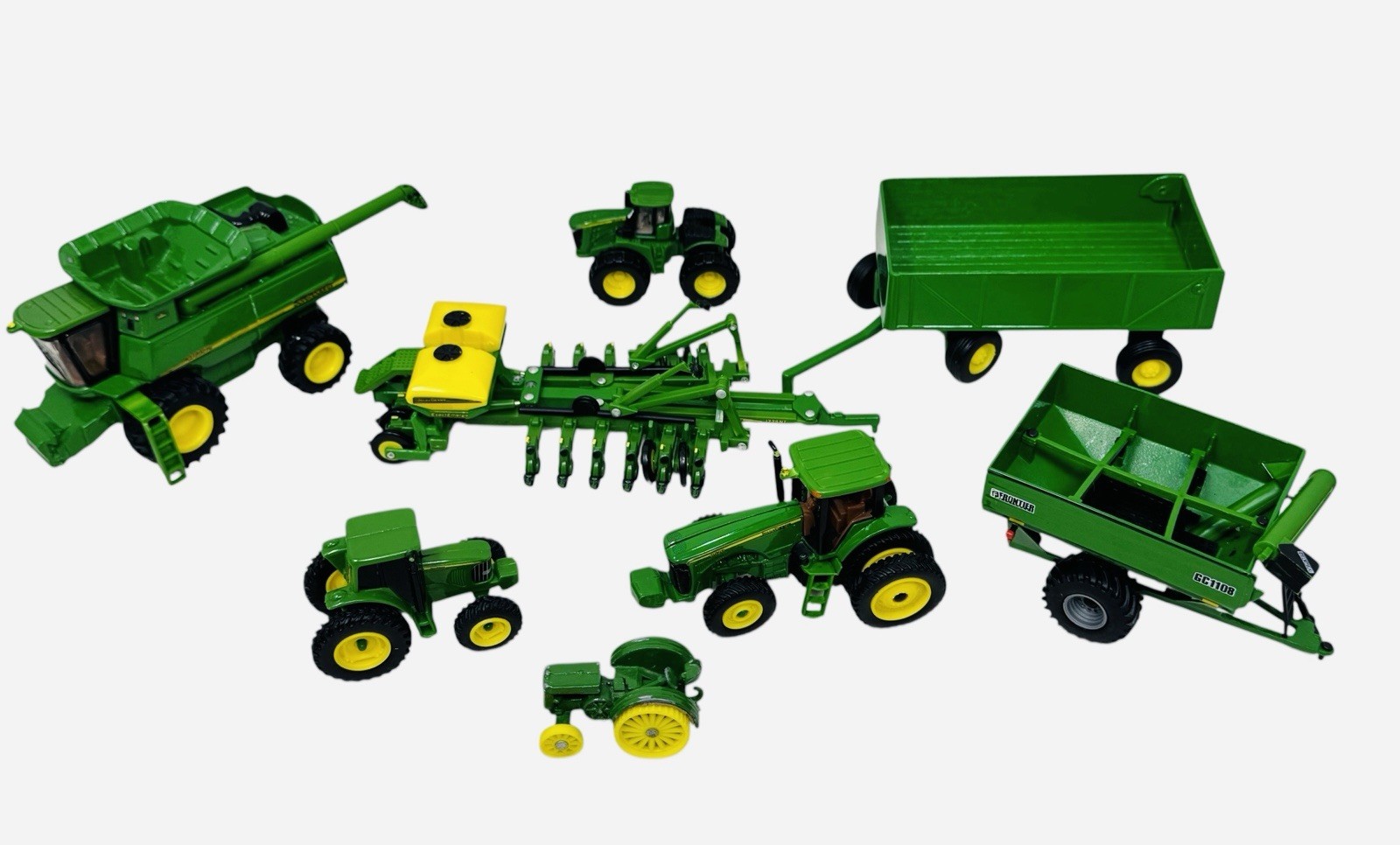 Lot of (8) ERTL John Deere Farm Tractors & Wagons Toys 8520 9760STS 1775NT