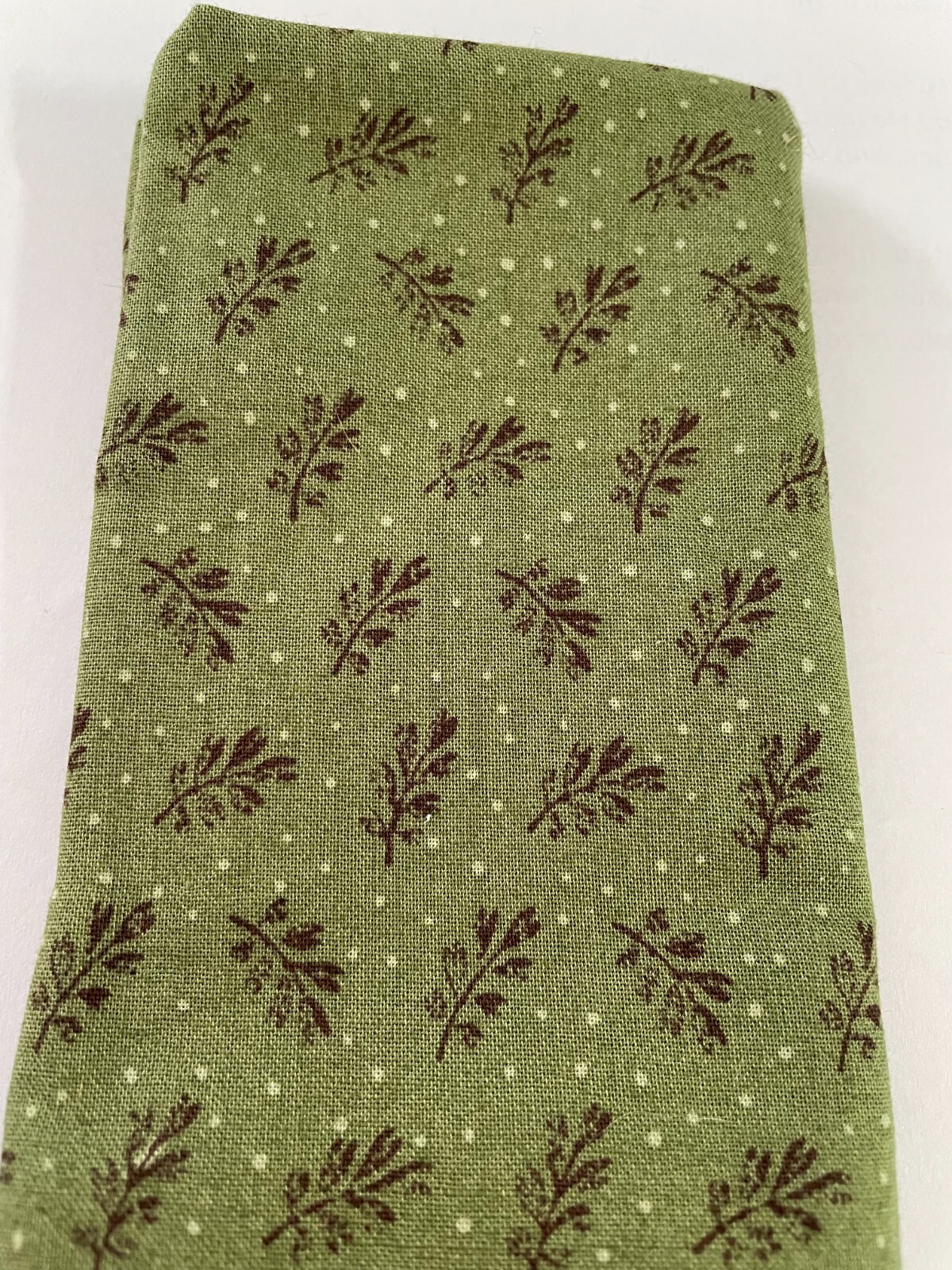 Quilting Fabric-Brown leaves, white dots on olive green background