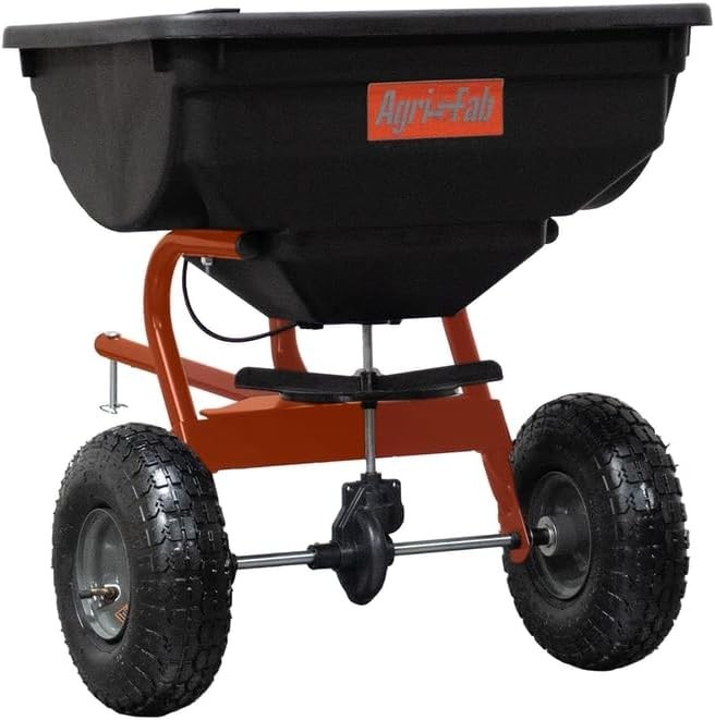 Compact 85 lb Pneumatic Tow Spreader for Effortless Lawn Maintenance