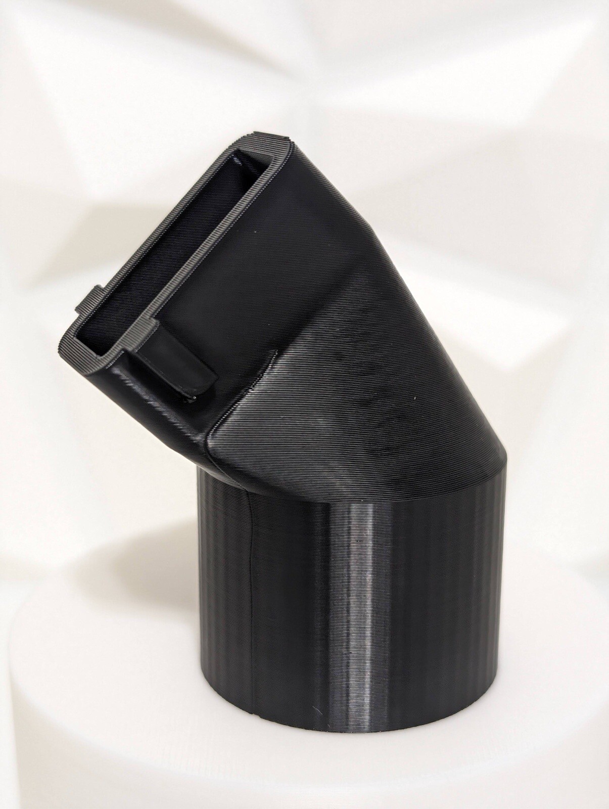 Adapter for DeWalt DW433 belt sander dust port to a common Shop-Vac 1-1/4" hose.