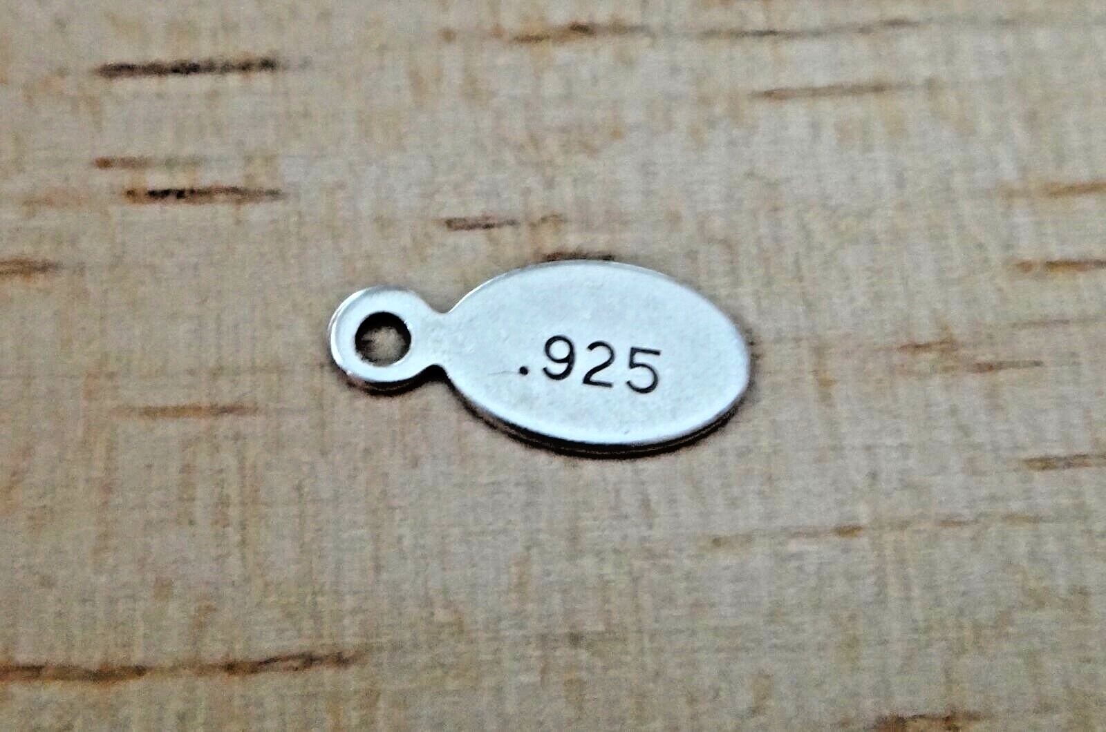 Tiny 9x5mm Sterling Silver Finding Oval Tag says 925