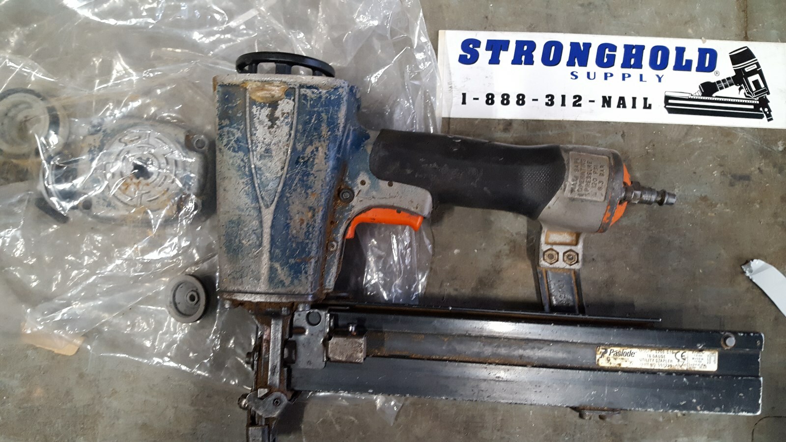 USED 402734 SPRING, LOWER WCE FOR PASLODE S200-S16-SELLING PART OF THE PICTURE