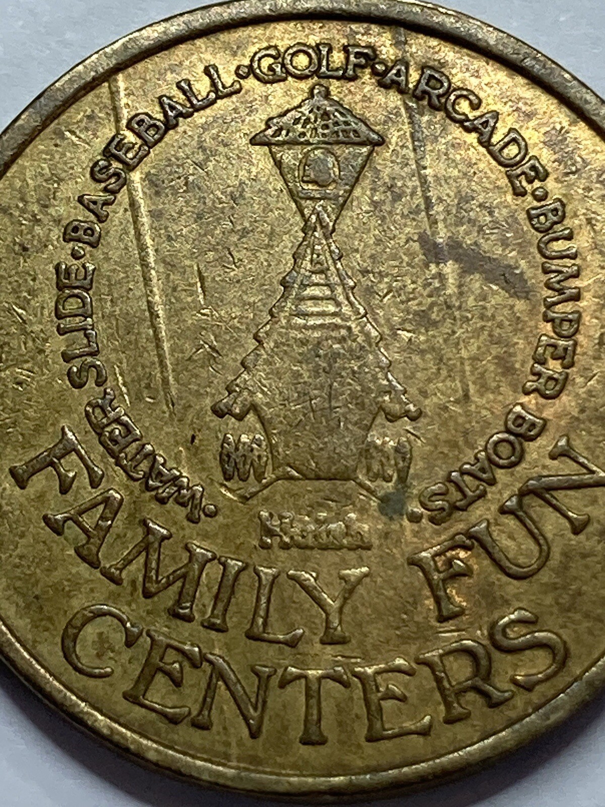 VINTAGE FAMILY FUN CENTERS HUISH SLOTTED BACK SAN DIEGO CALIFORNIA BRASS (#K2)