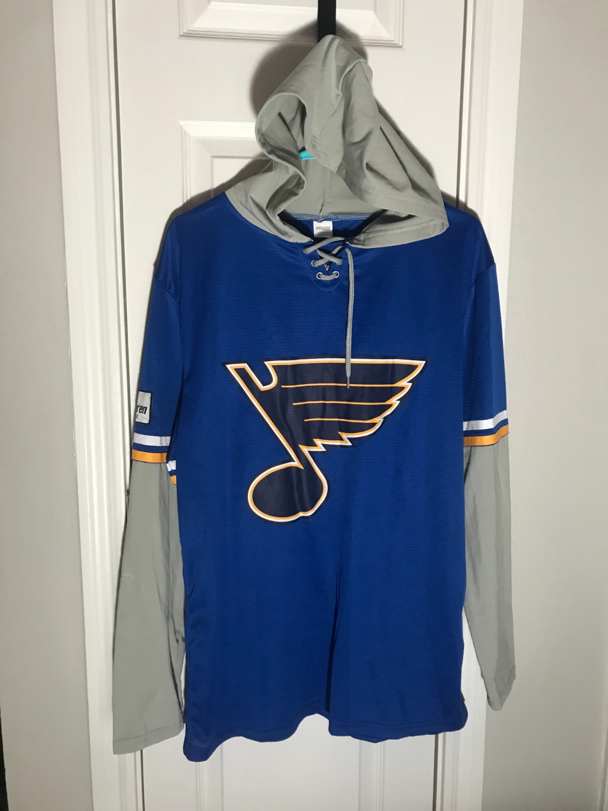 St. Louis Blues: LONG SLEEVE HOODED SHIRT #24 (2024): ADULT X-LARGE