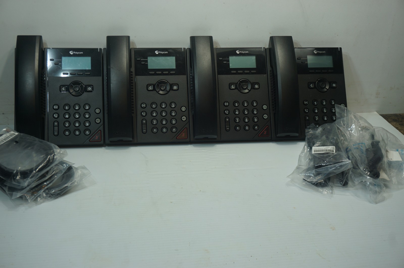 Polycom VVX150 Phones Qty-Four with cords and AC Adapters