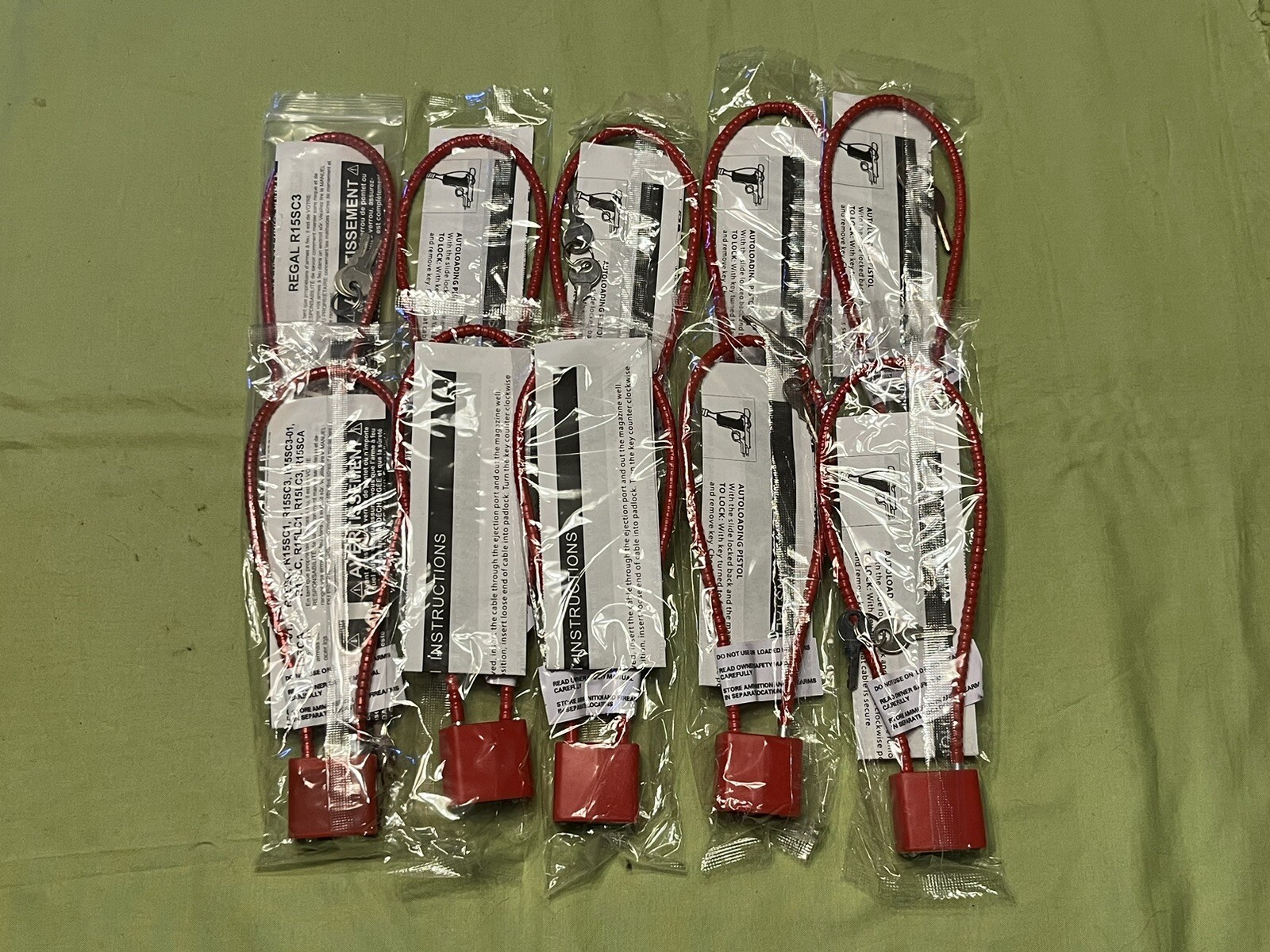 NEW PISTOL CABLE LOCK LOT OF (10) RED WITH 2 KEYS EACH UNKNOWN BRAND